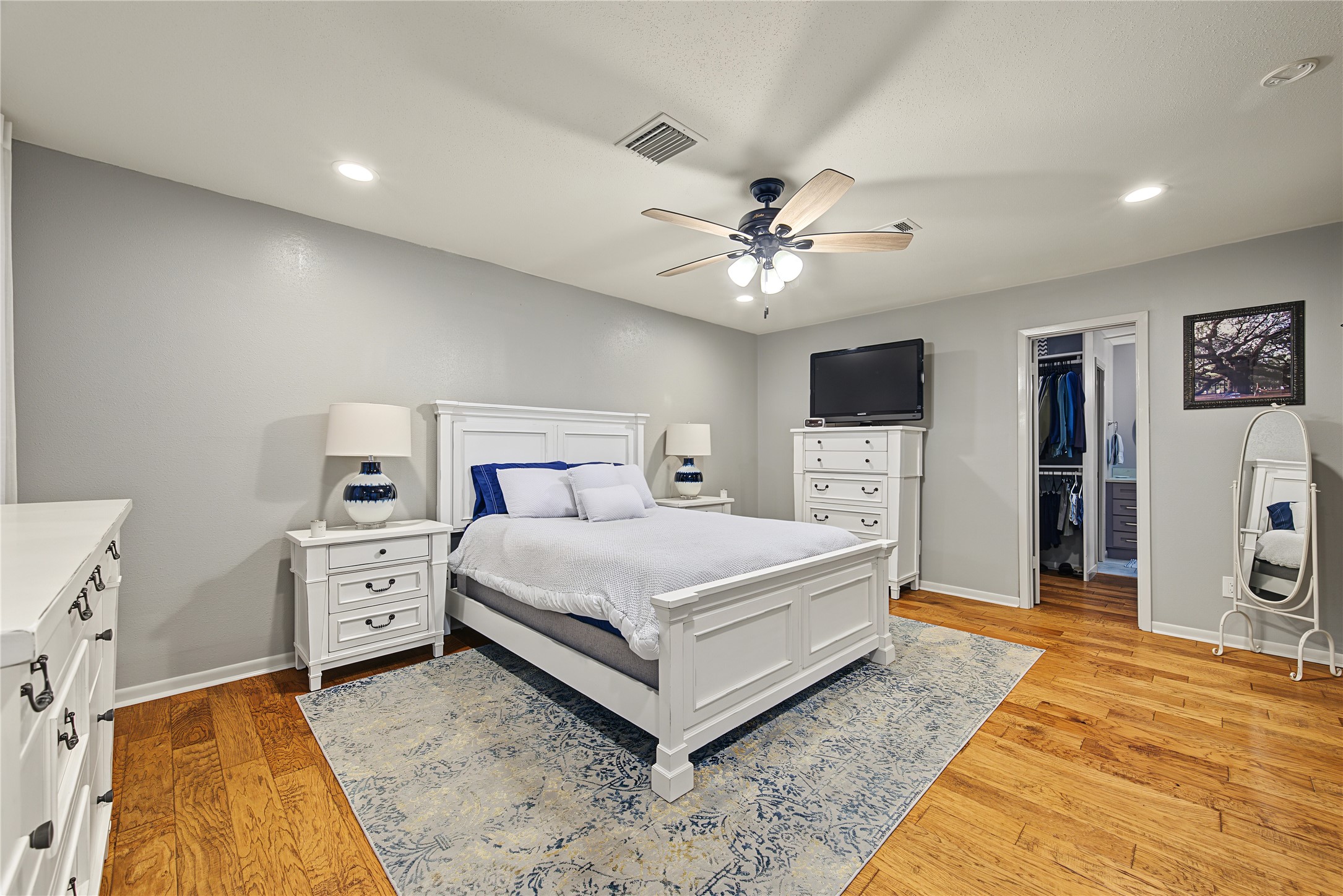 Additional primary bedroom view with adjoining walk-in closet. Additional primary bedroom view with adjoining walk-in closet.