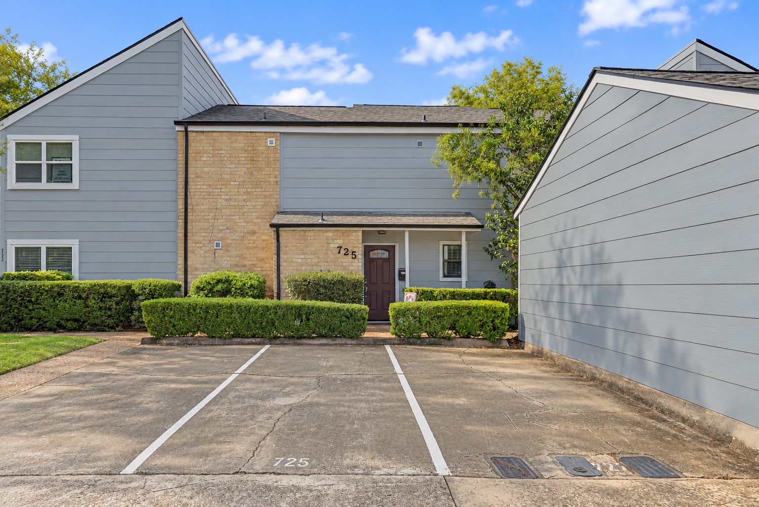 Two-story townhome with landscaped entrance and convenient front parking. Two-story townhome with landscaped entrance and convenient front parking.