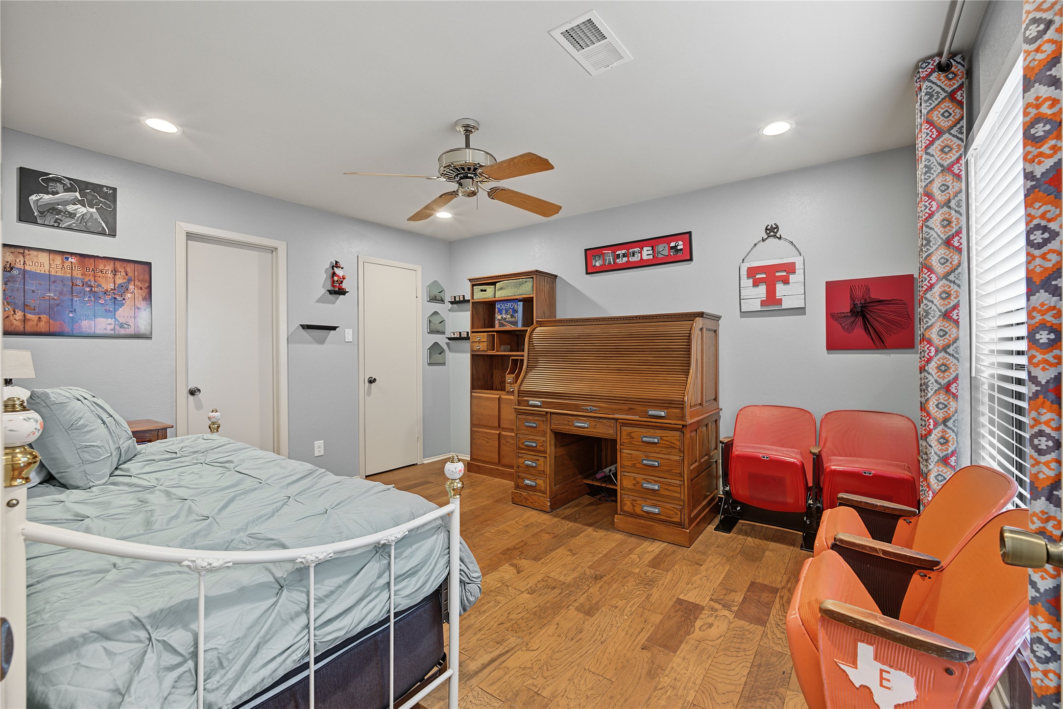 Additional bedroom featuring wood look laminate floors.