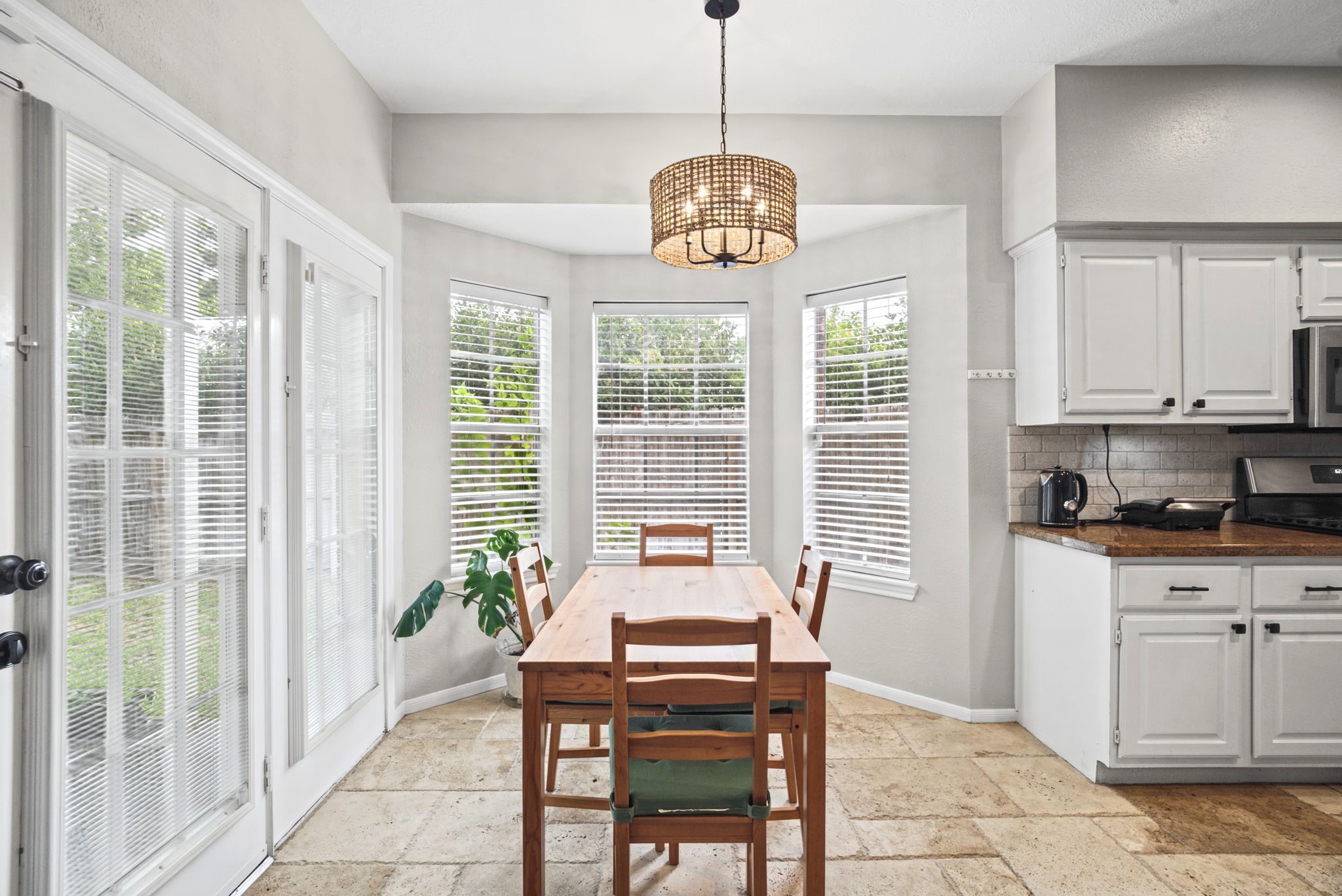 Enjoy a convenient breakfast area located just off the kitchen and living room, offering the perfect spot for casual meals, morning coffee, and everyday dining with easy access to the heart of the home.