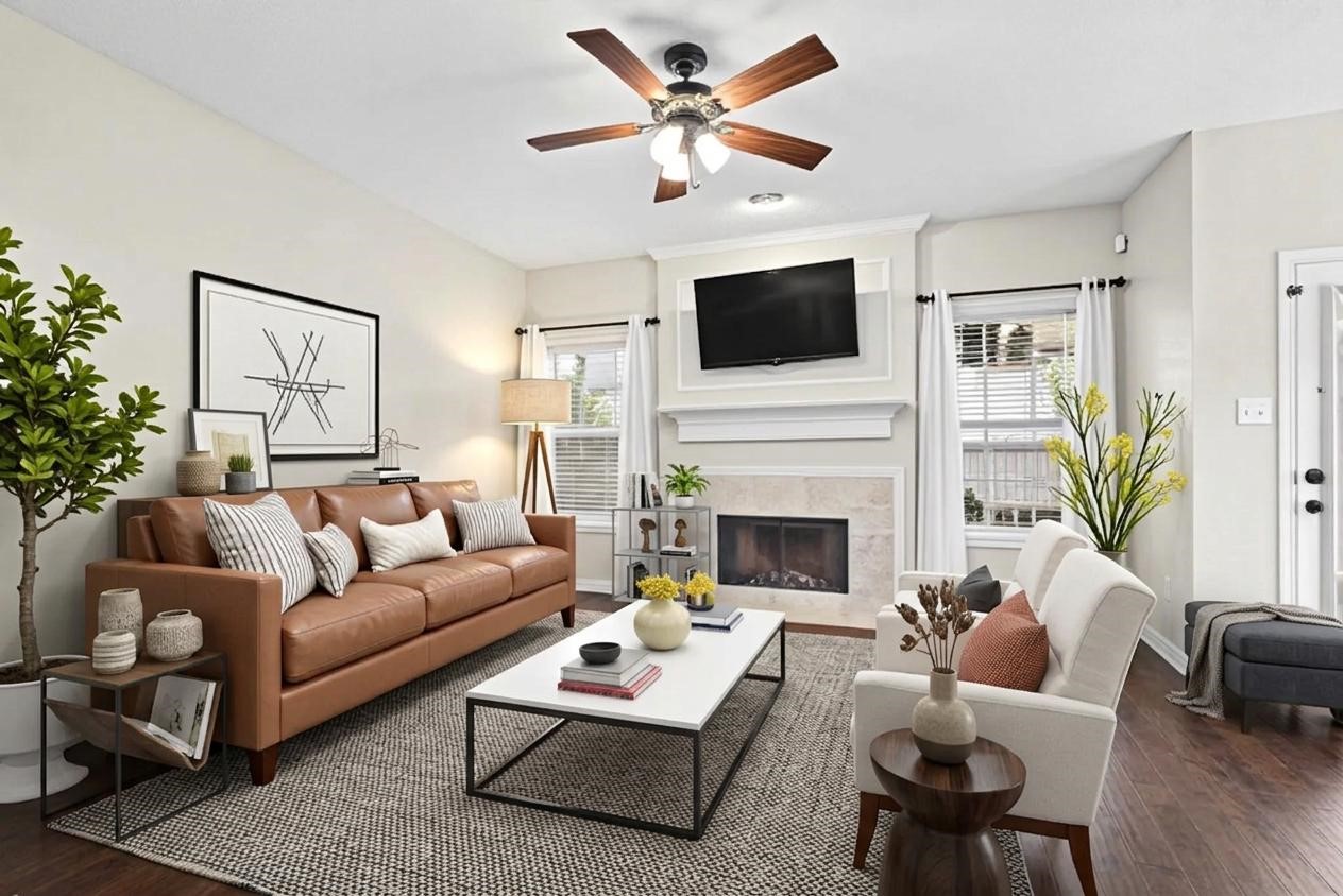Beautiful hard-engineered wood flooring adds warmth and elegance to the living room, conveniently located just off the kitchen. This cozy, formal living space offers a welcoming atmosphere perfect for relaxing, entertaining guests, and enjoying time with family.