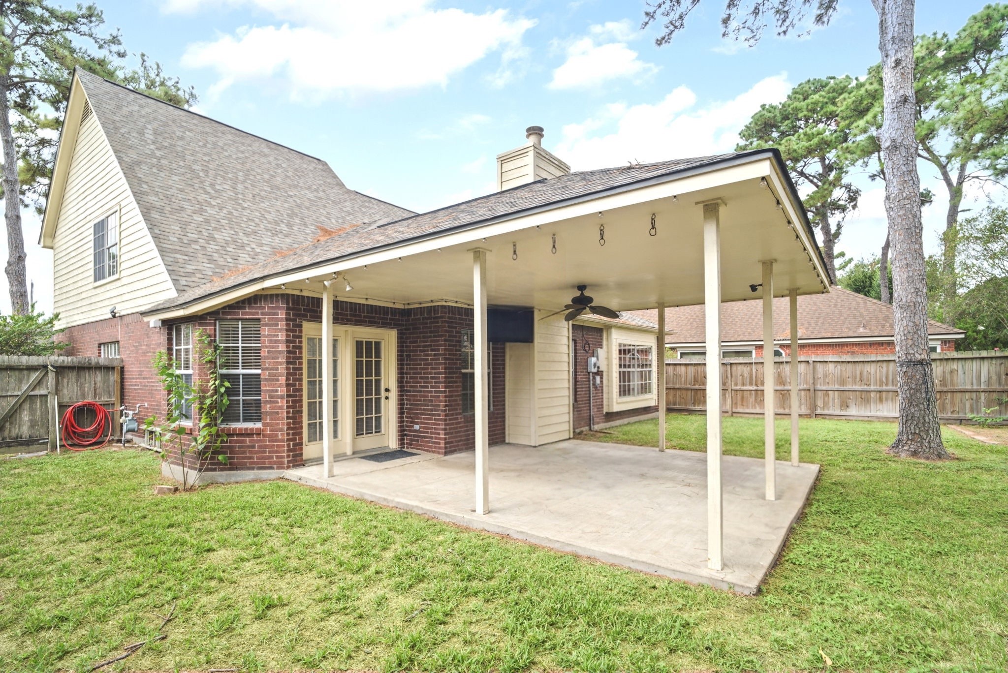 Enjoy a spacious, covered patio perfect for outdoor entertaining, relaxing with family and friends, or sipping your morning coffee. This inviting outdoor space provides a comfortable setting to enjoy the fresh air year-round, rain or shine.