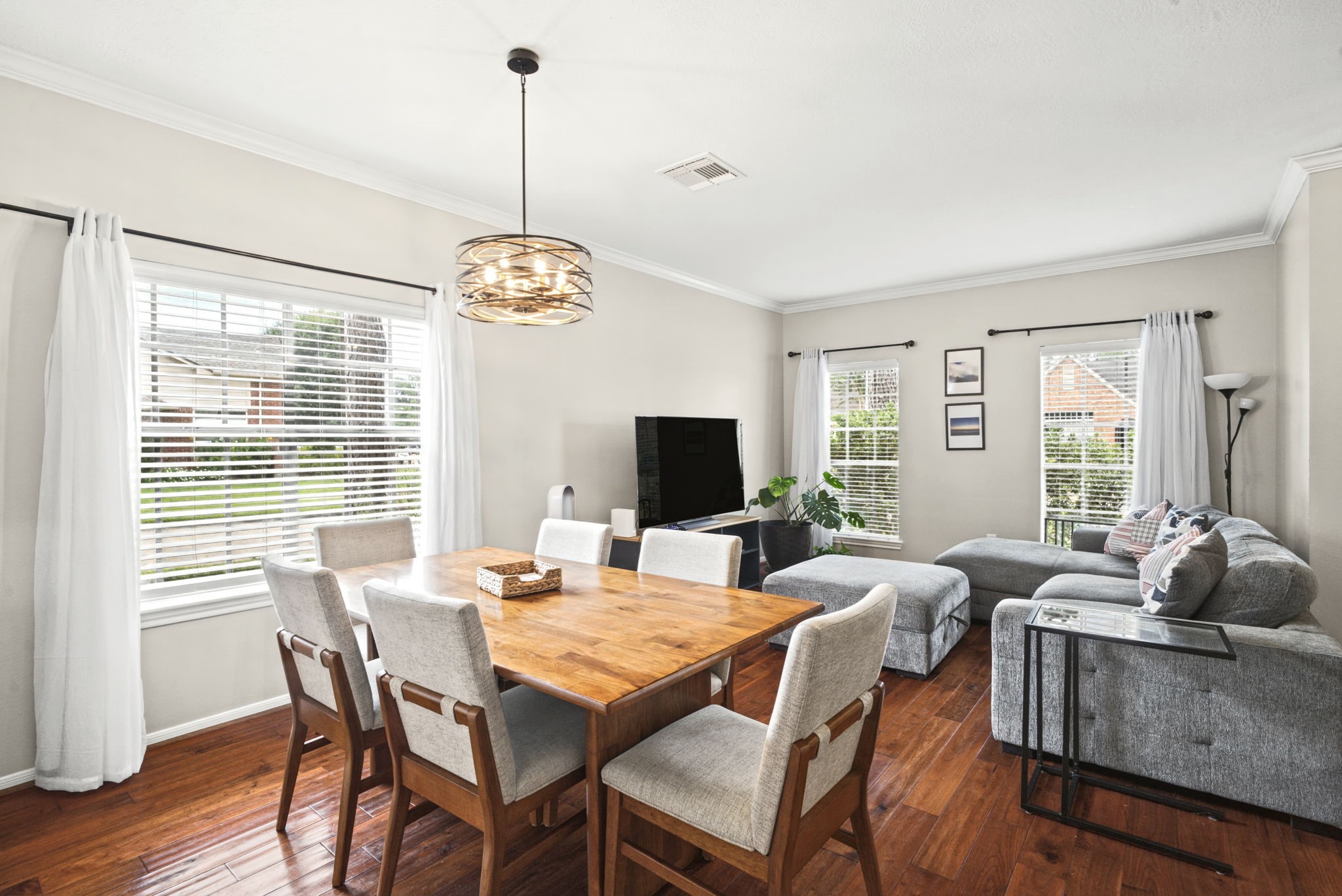 Enjoy an open-concept dining area overlooking the living room, creating a spacious and inviting atmosphere perfect for entertaining guests, hosting dinner parties, and spending quality time with family and friends.