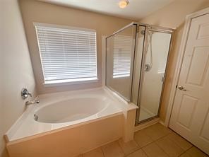 Separate shower and garden tub in the primary bath