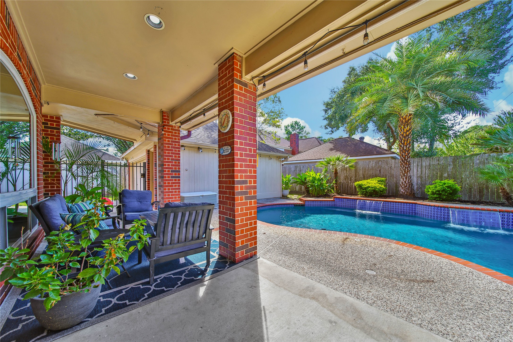 The covered patio is the perfect space to relax and enjoy the cool fall weather on a beautiful day!