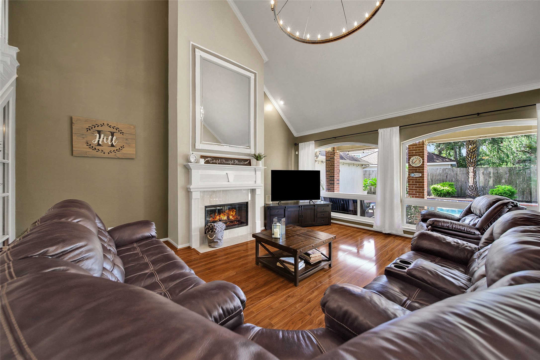 The picture windows and vaulted ceilings allow for the home to stay light and bright with gorgeous views of your backyard paradise.