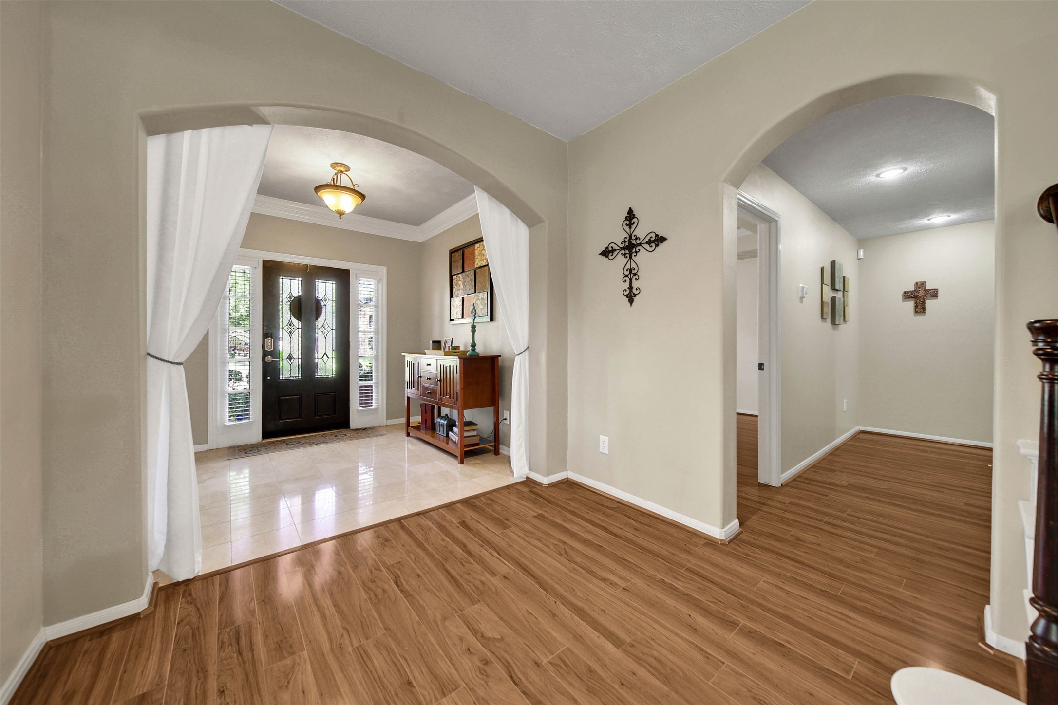 The hallway to the right leads to the primary suite.