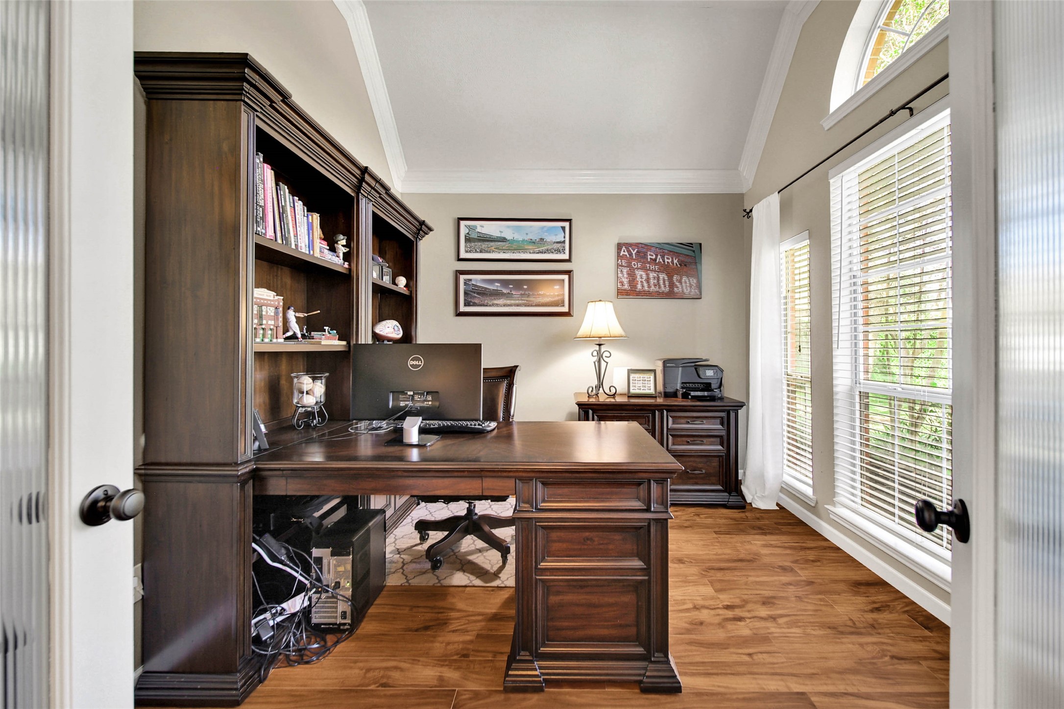 The office has double doors and is located at the front of the home overlooking the serene cul de sac.
