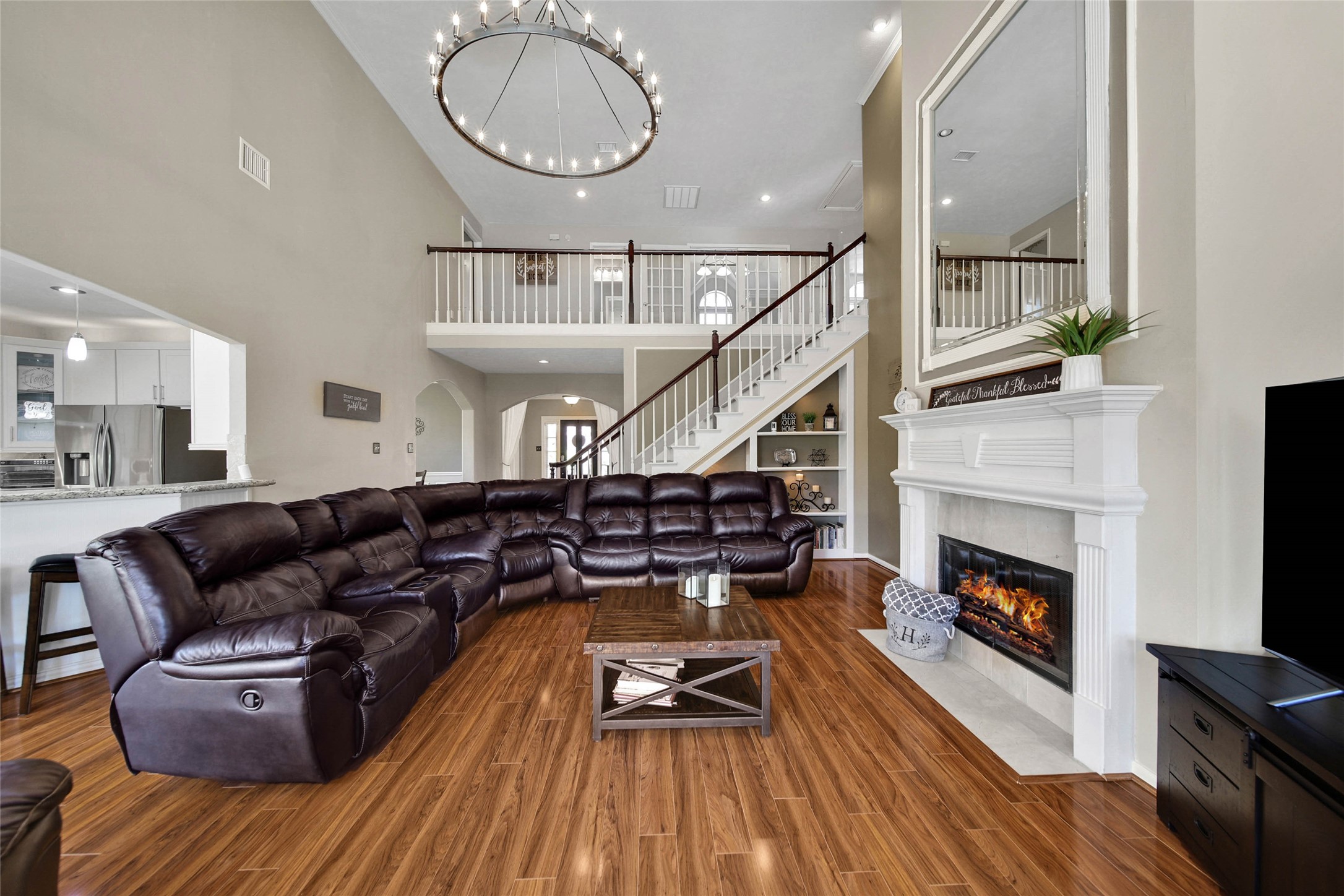 The living room is nice and big and open to the kitchen.