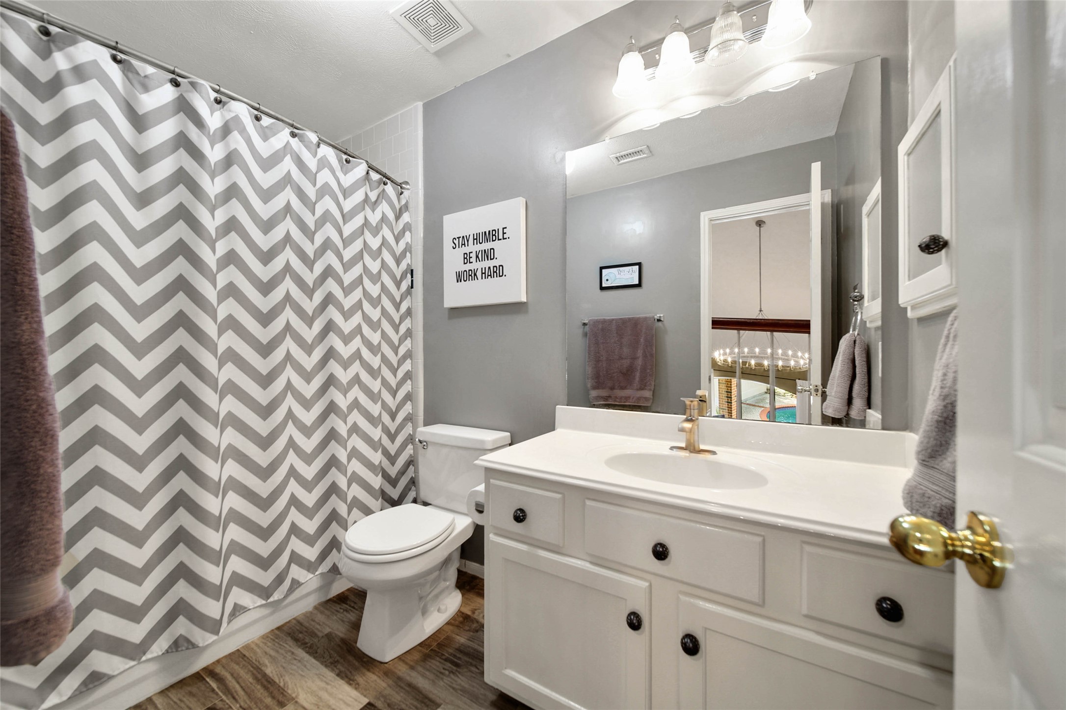 Bathroom number 3 has a shower/tub combo.