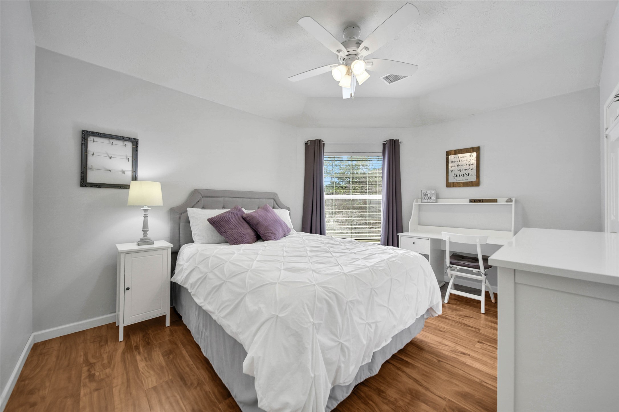 Bedroom #2 is right at the top of the stairs. It overlooks the left side of the home by the driveway.
