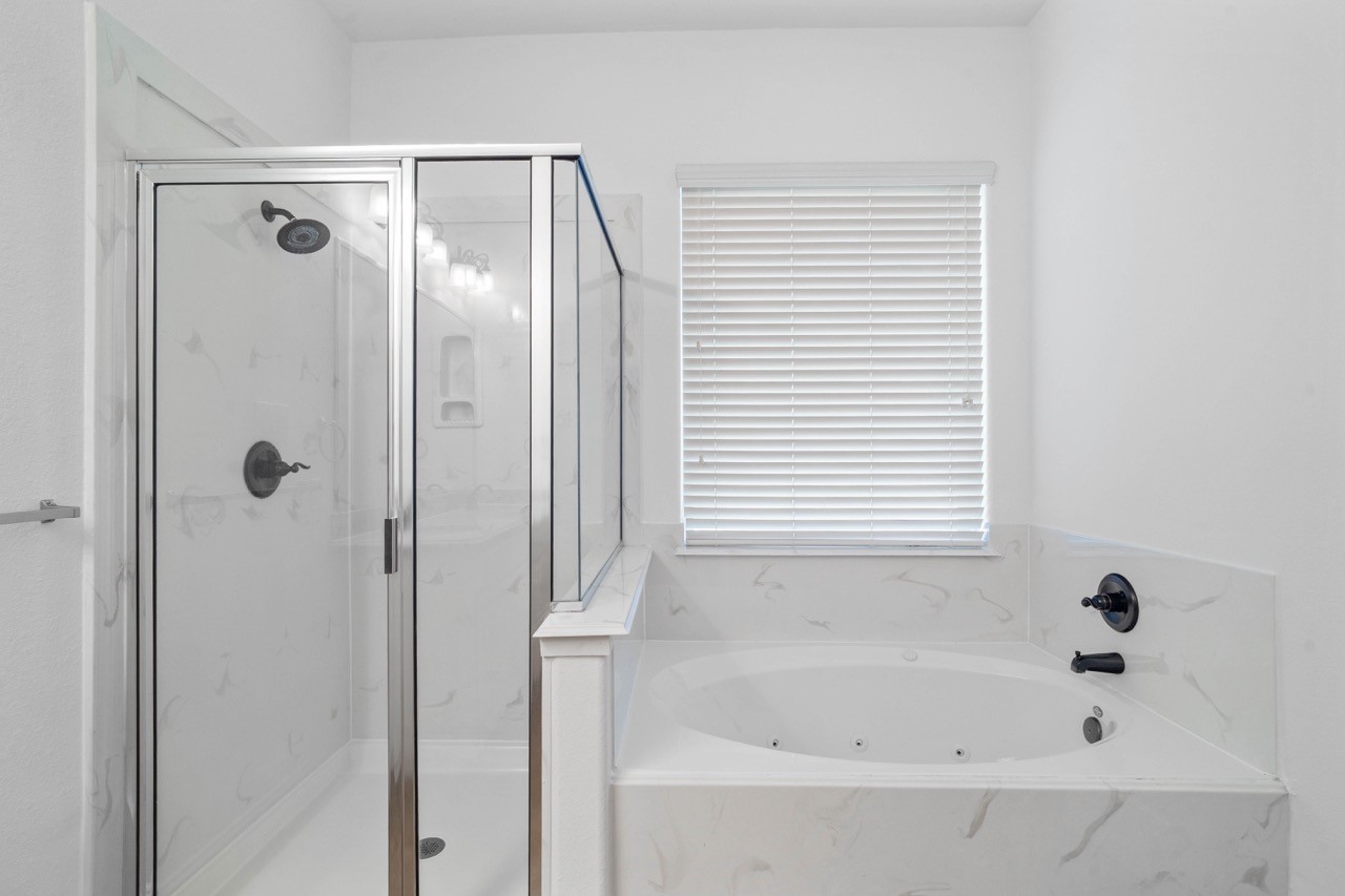 Primary bathroom has separate shower and bath