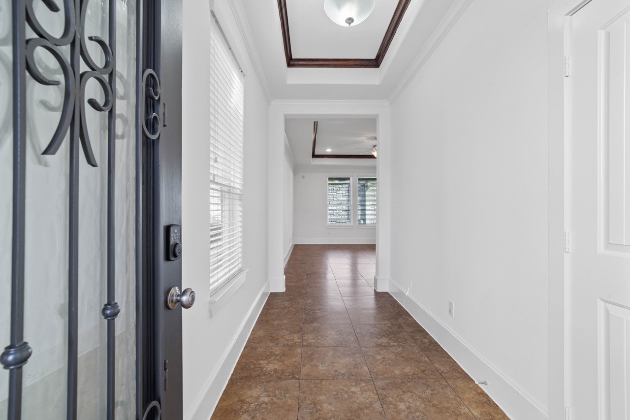Inside the home with a hallway entrance to the left is the half bath