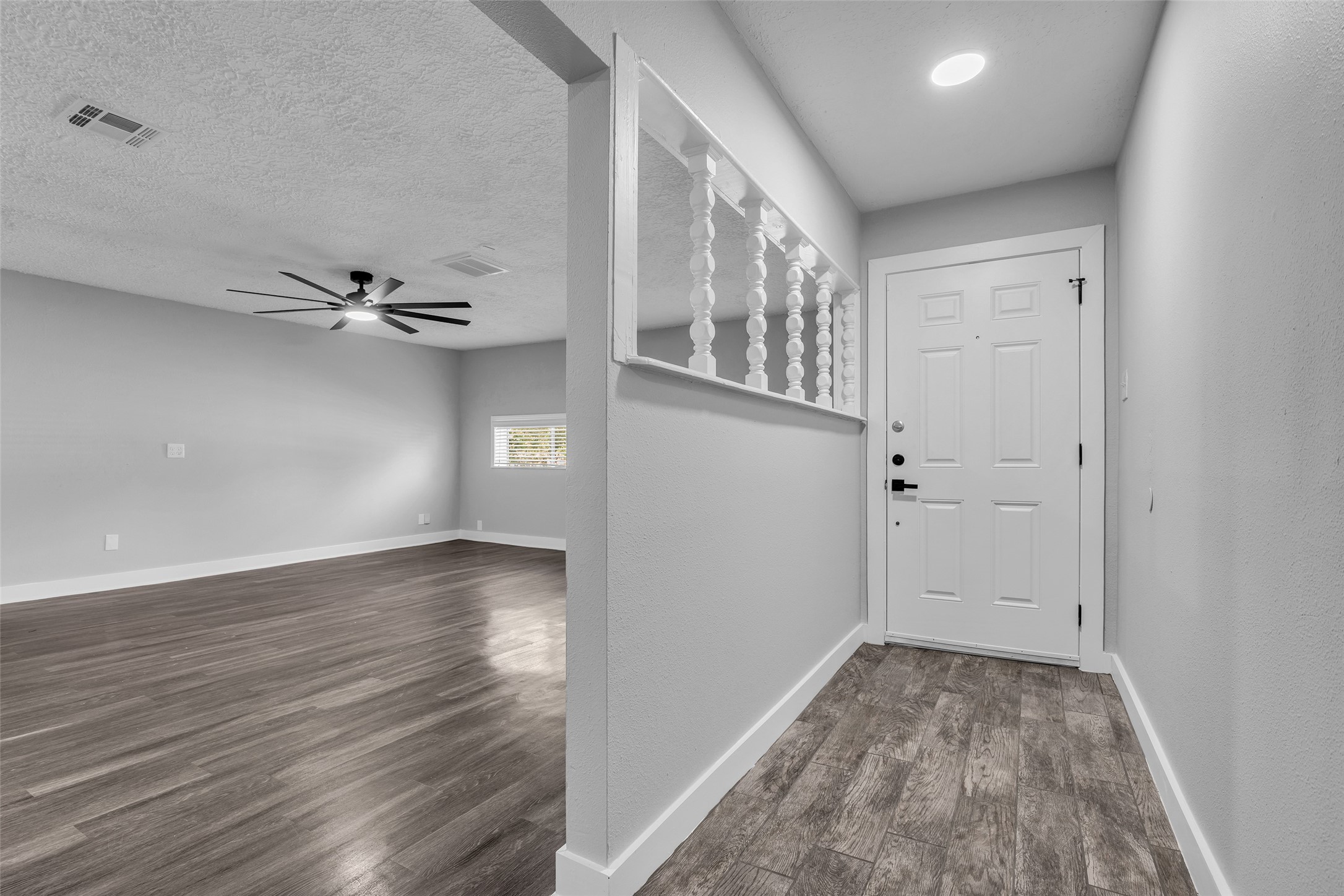Step inside to wood-look plank flooring, with the family room just off the entry.
