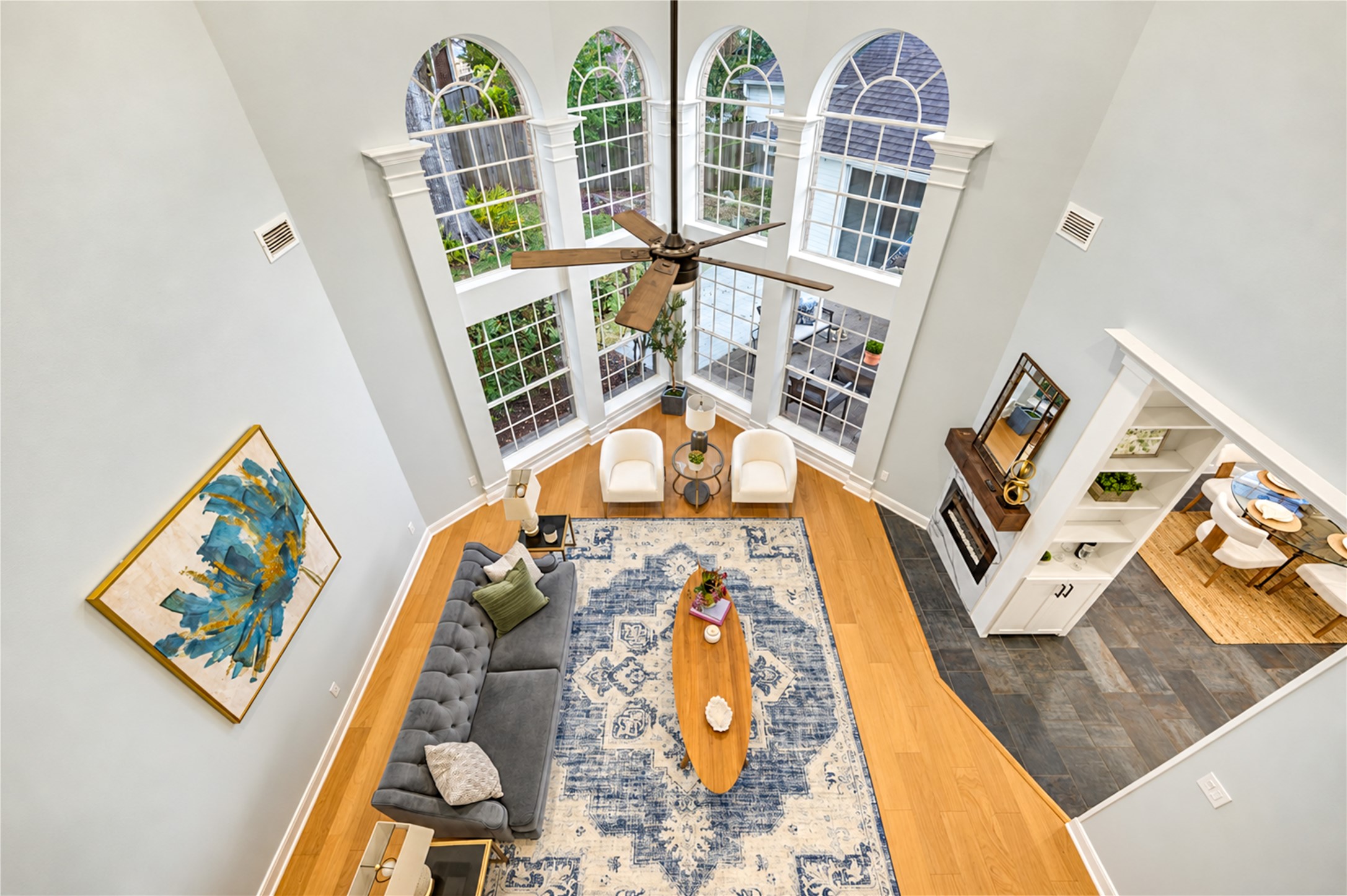 Soaring ceilings, dramatic two-story windows and an abundance of natural light create a breathtaking living space! Whether hosting memorable gatherings or enjoying a quiet evening at home, this impressive room offers an inviting atmosphere for making lasting memories. Soaring ceilings, dramatic two-story windows and an abundance of natural light create a breathtaking living space! Whether hosting memorable gatherings or enjoying a quiet evening at home, this impressive room offers an inviting atmosphere for making lasting memories.