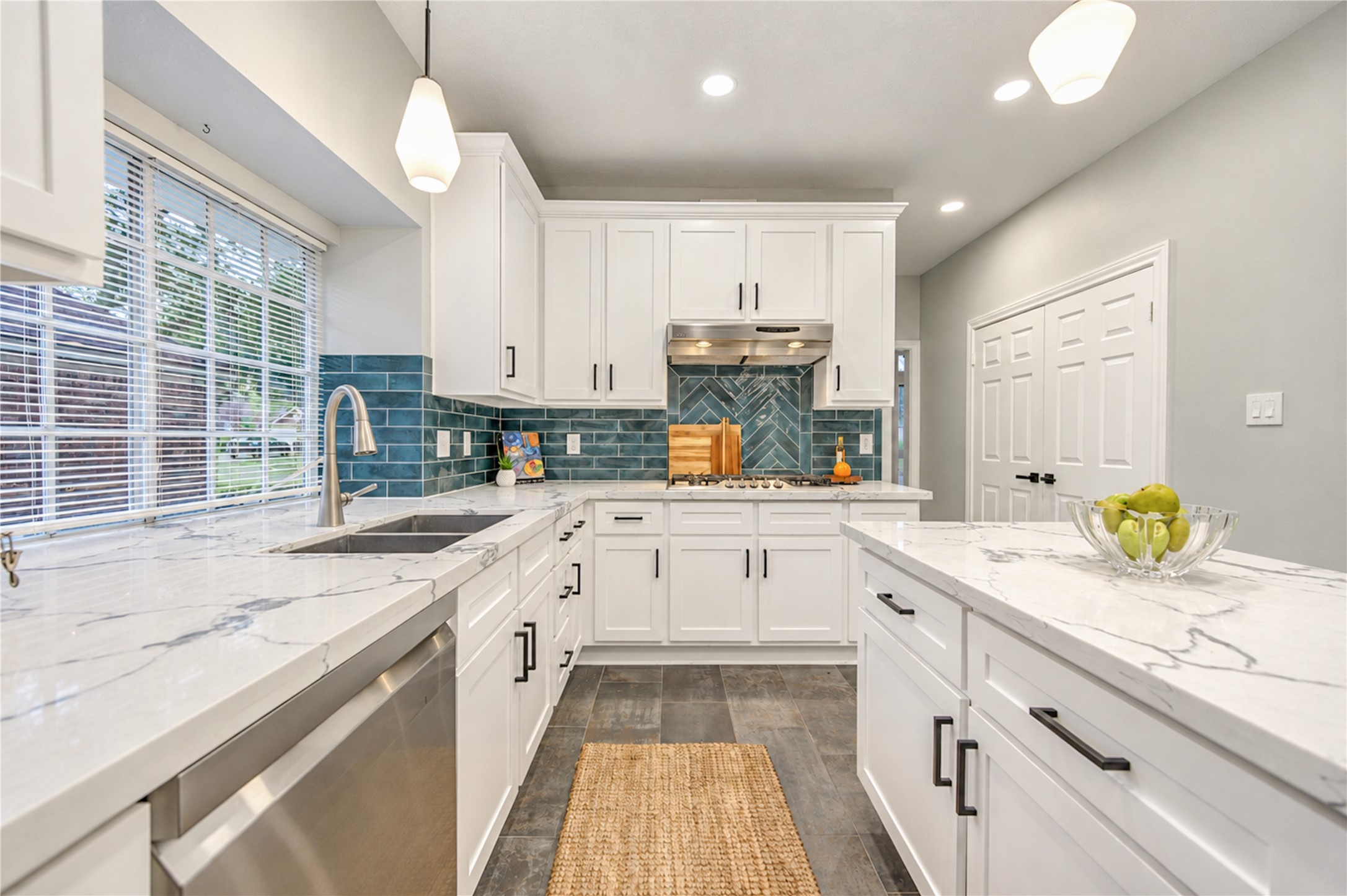 The heart of the home! This beautifully renovated kitchen brings everyone together with gleaming quartz countertops, crisp white cabinetry, stainless steel appliances and a stylish subway tile backsplash. Whether preparing a quiet morning breakfast or hosting friends and family, this inviting space makes every gathering feel special. The heart of the home! This beautifully renovated kitchen brings everyone together with gleaming quartz countertops, crisp white cabinetry, stainless steel appliances and a stylish subway tile backsplash. Whether preparing a quiet morning breakfast or hosting friends and family, this inviting space makes every gathering feel special.