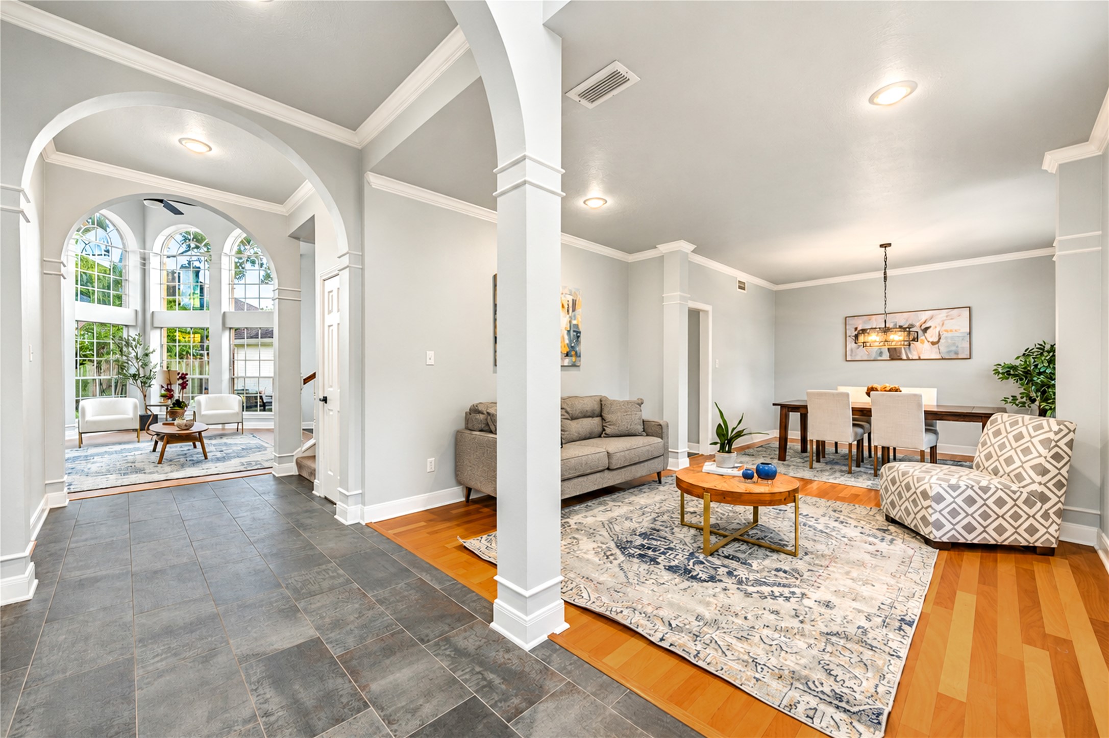 First impressions are everything! Just off the entry, this elegant formal living room offers endless possibilities. Create a sophisticated space for entertaining, a cozy sitting room for quiet conversations or a stylish retreat that perfectly reflects your lifestyle. Beautiful architectural details and natural light make this versatile space truly inviting! First impressions are everything! Just off the entry, this elegant formal living room offers endless possibilities. Create a sophisticated space for entertaining, a cozy sitting room for quiet conversations or a stylish retreat that perfectly reflects your lifestyle. Beautiful architectural details and natural light make this versatile space truly inviting!