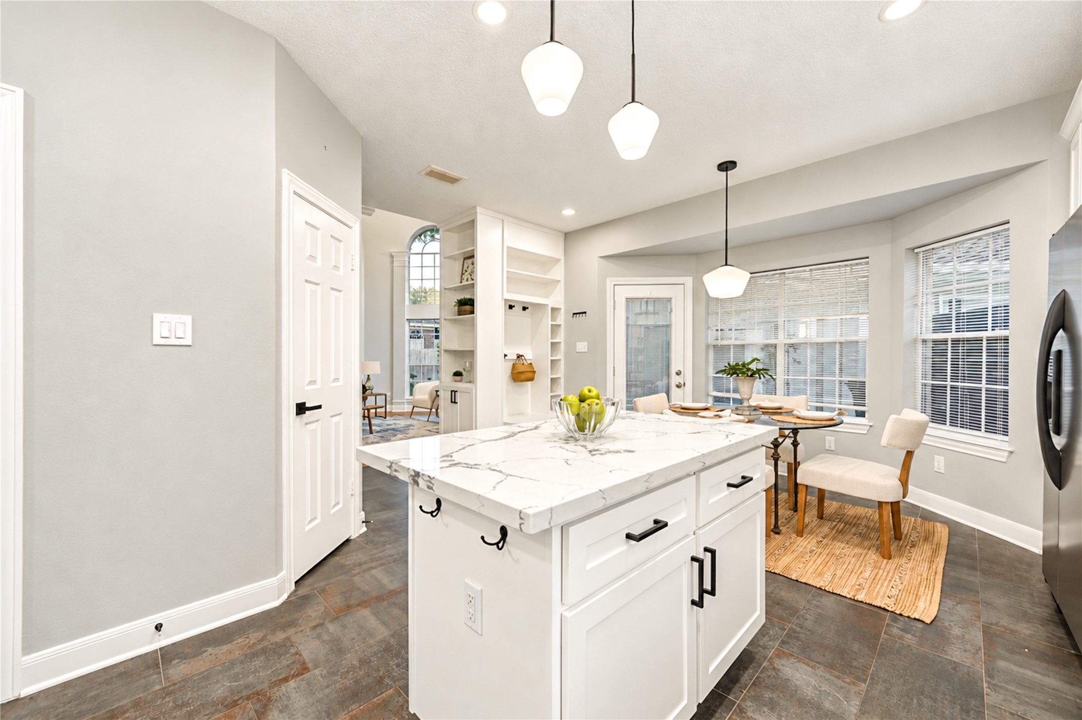 From morning coffee to casual dinners, this thoughtfully designed kitchen and breakfast area make everyday living a delight! The spacious island provides the perfect gathering spot, while the open layout creates an effortless connection between cooking, dining and spending time together.