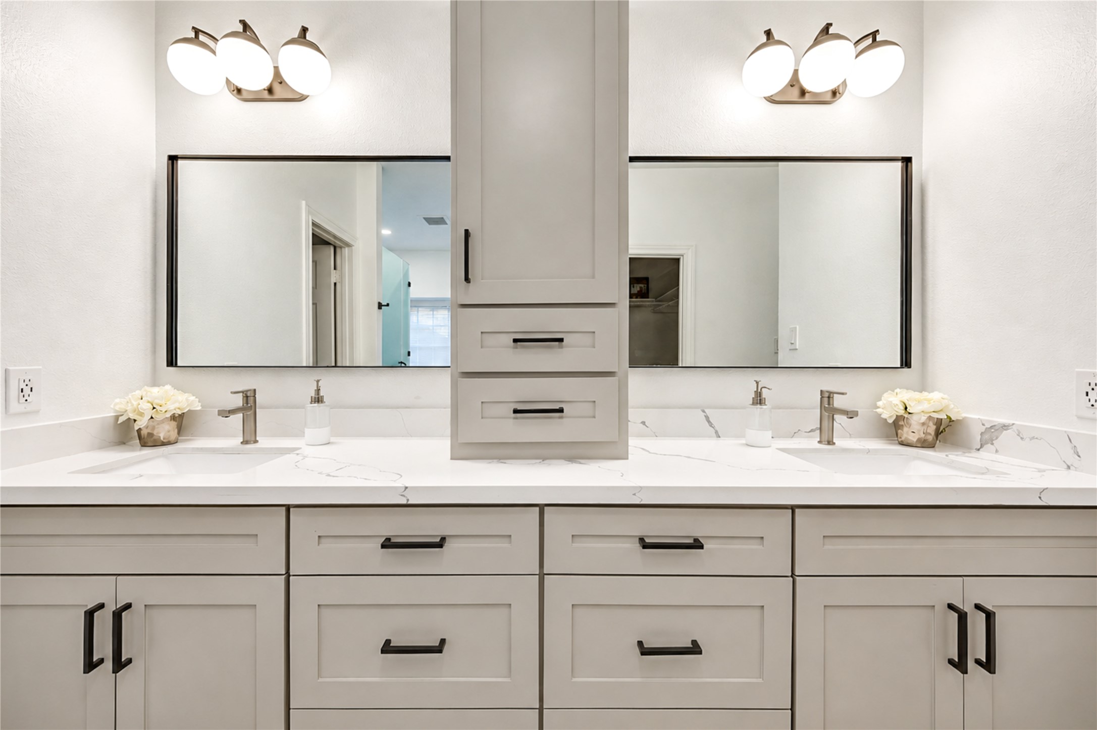 A little luxury makes every day better! This beautifully renovated primary bath features separate vanities with quartz countertops, stylish mirrors and elegant finishes, giving everyone their own space to get ready in the morning or unwind at the end of the day. Thoughtfully designed for comfort, convenience and effortless style!
