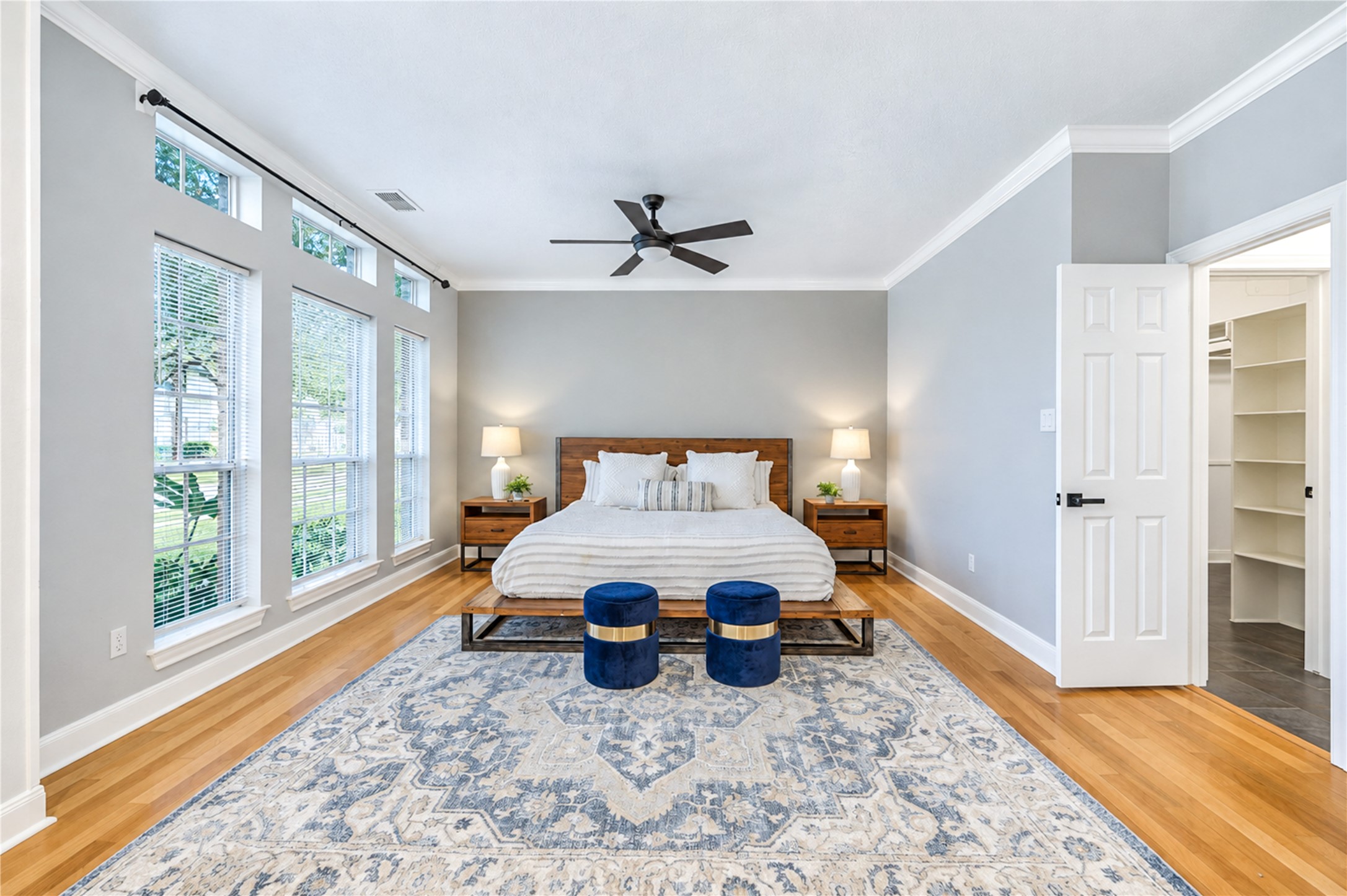 Wake up refreshed in this spacious first-floor primary retreat, where beautiful natural light, warm wood floors and soothing neutral tones create a peaceful escape. With generous space to relax and unwind, it's the perfect sanctuary to begin and end each day in comfort.