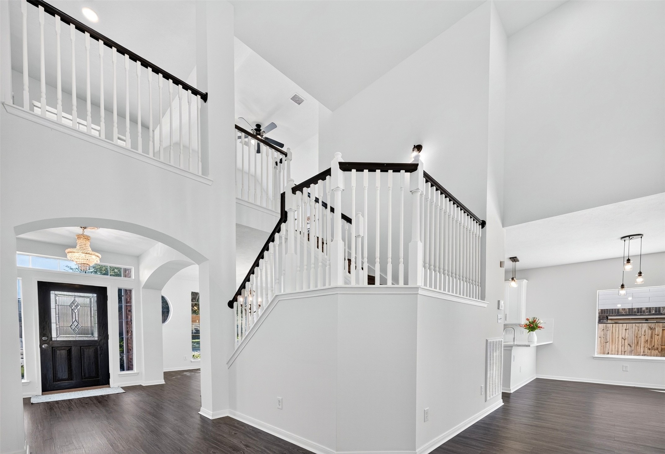 Stunning entryway with high ceilings and a grand staircase