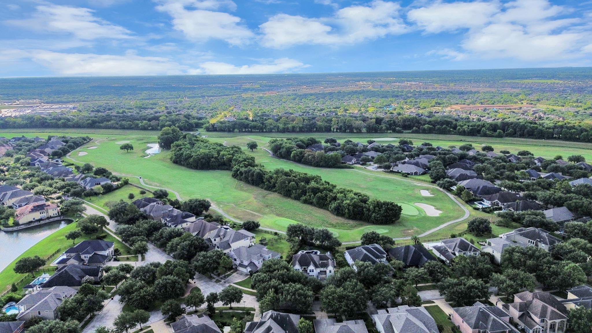 Nestled in a picturesque neighborhood, this home offers breathtaking views of a lush golf course surrounded by mature trees, providing a serene and luxurious setting.
