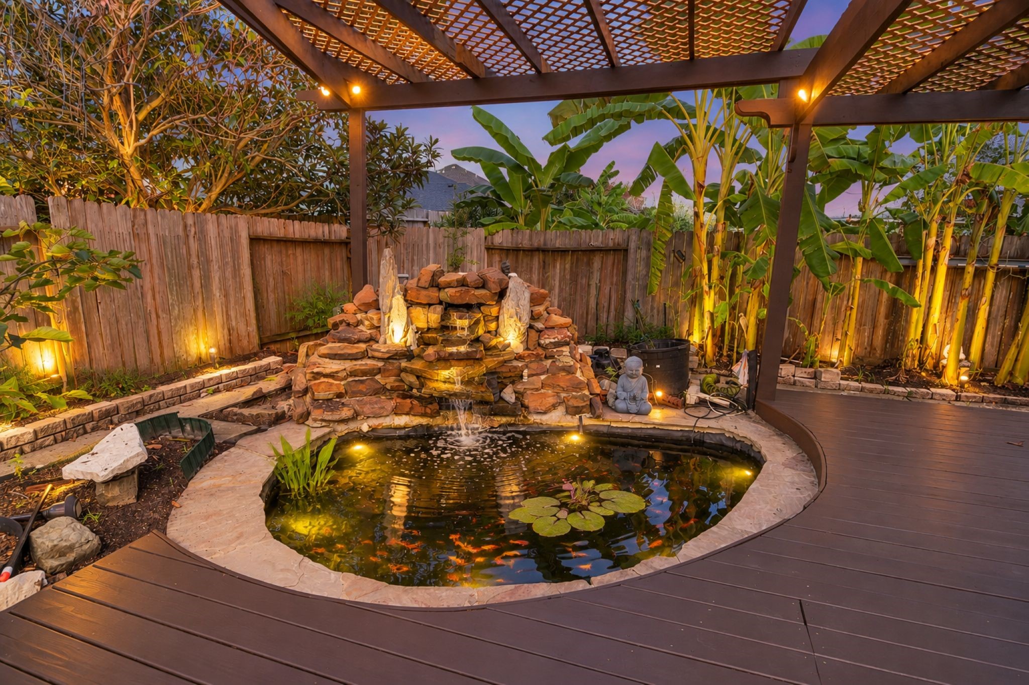 VIRTUAL STAGING
Experience tranquility with a stunning koi pond nestled under a charming pergola, surrounded by lush greenery and ambient lighting for a serene backyard retreat.