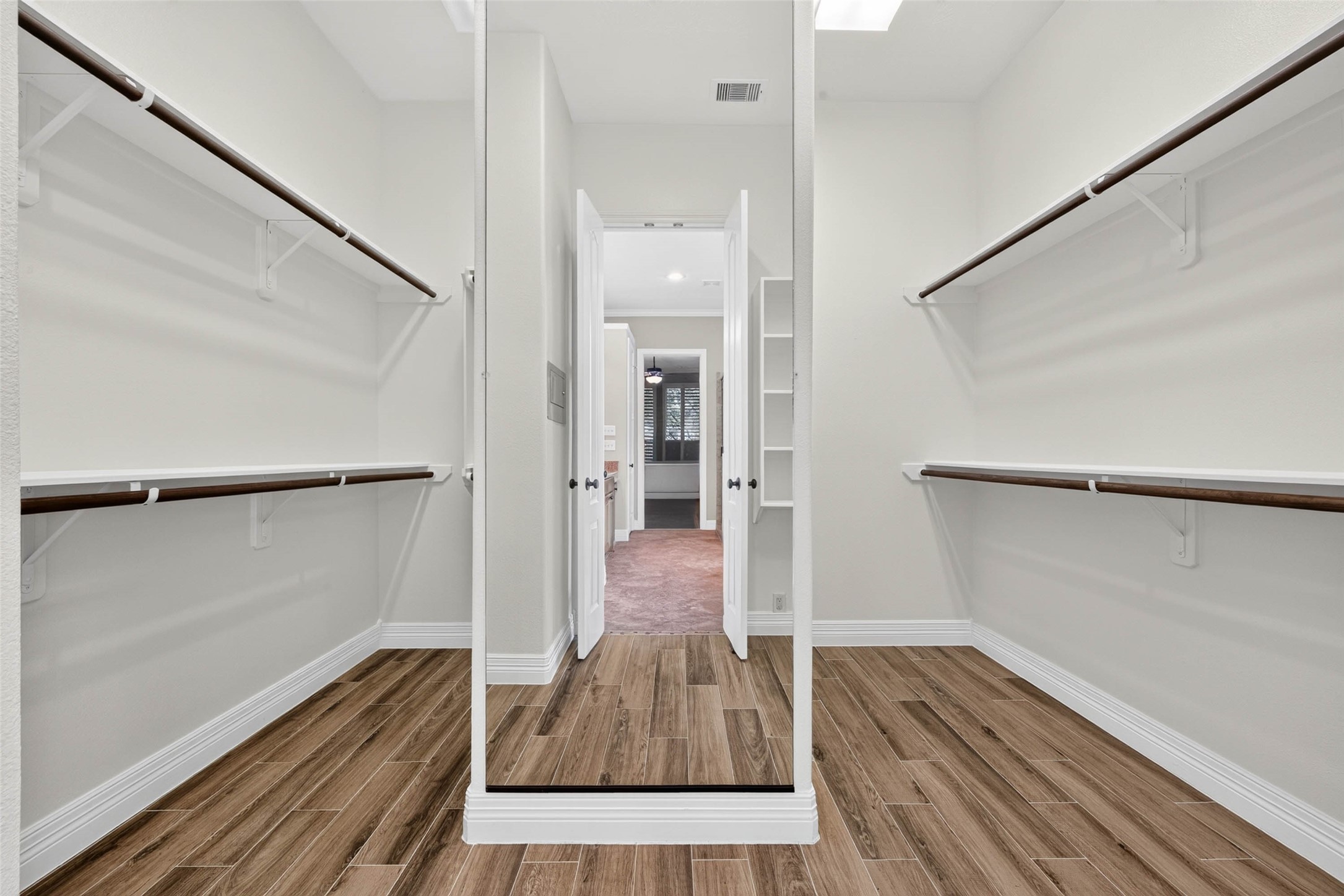 The primary closet features extra space and a large full-length mirror
