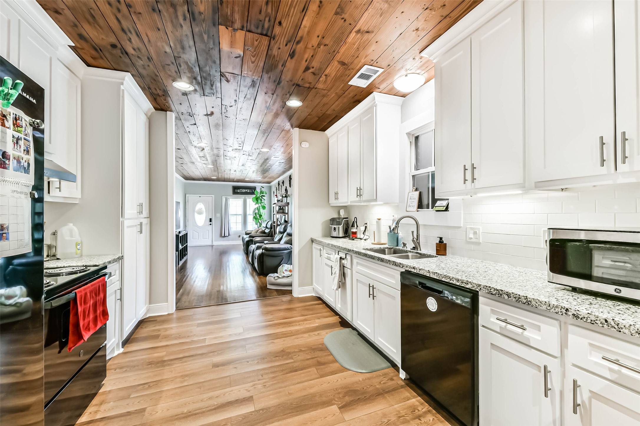 Kitchen with granite counters and updated appliances