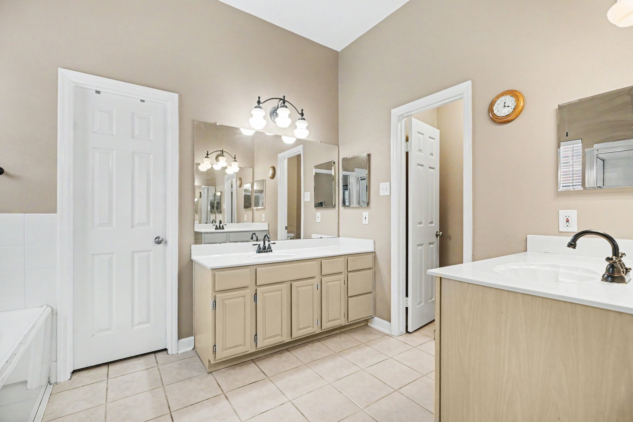 Primary bathroom with two separate sink areas