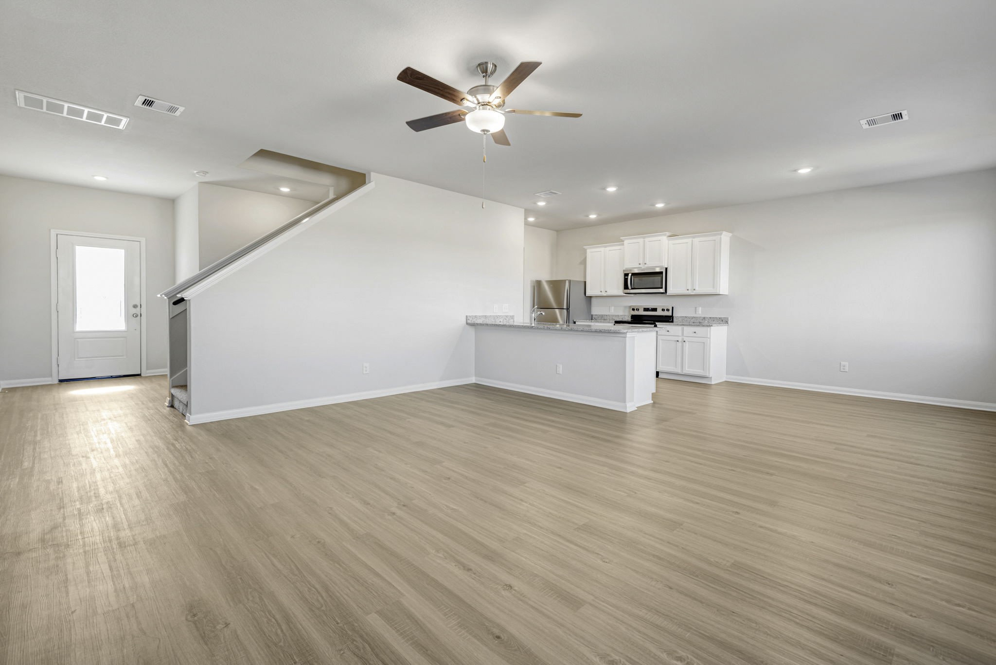 Spacious living room, open to the kitchen and dining area.