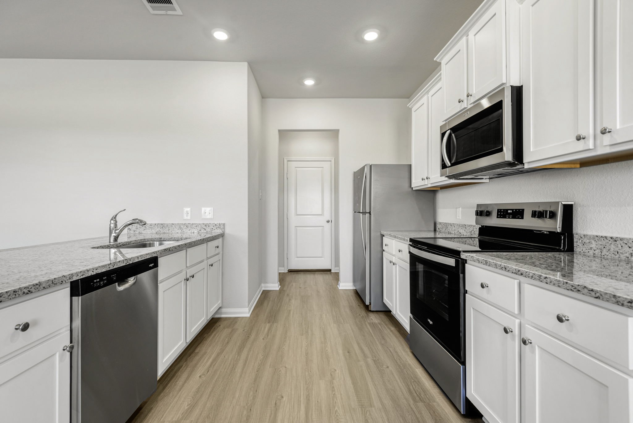Kitchen with upgraded Whirlpool kitchen appliances.