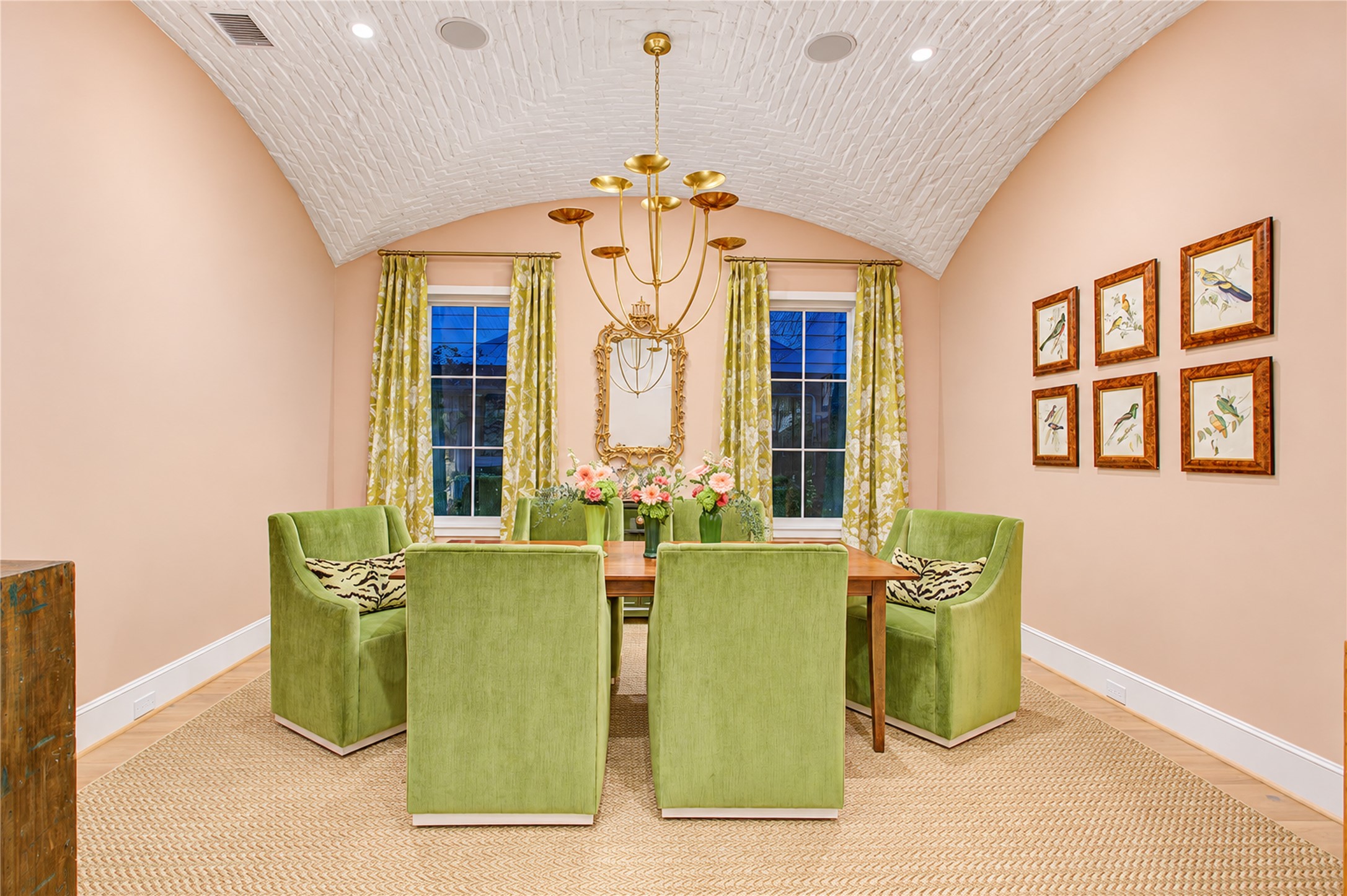 Soft blush walls and wide-plank white oak floors create a refined, effortlessly elegant dining setting.