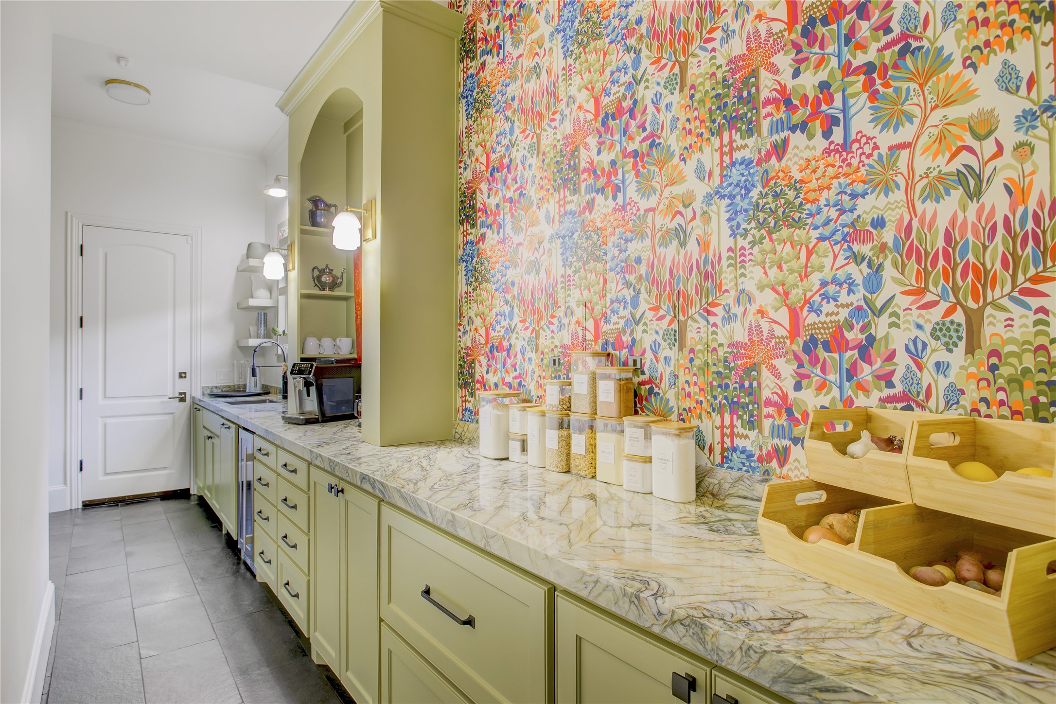 Playful Thibaut wallpaper adds designer flair to this prep kitchen, complete with a dedicated coffee station.