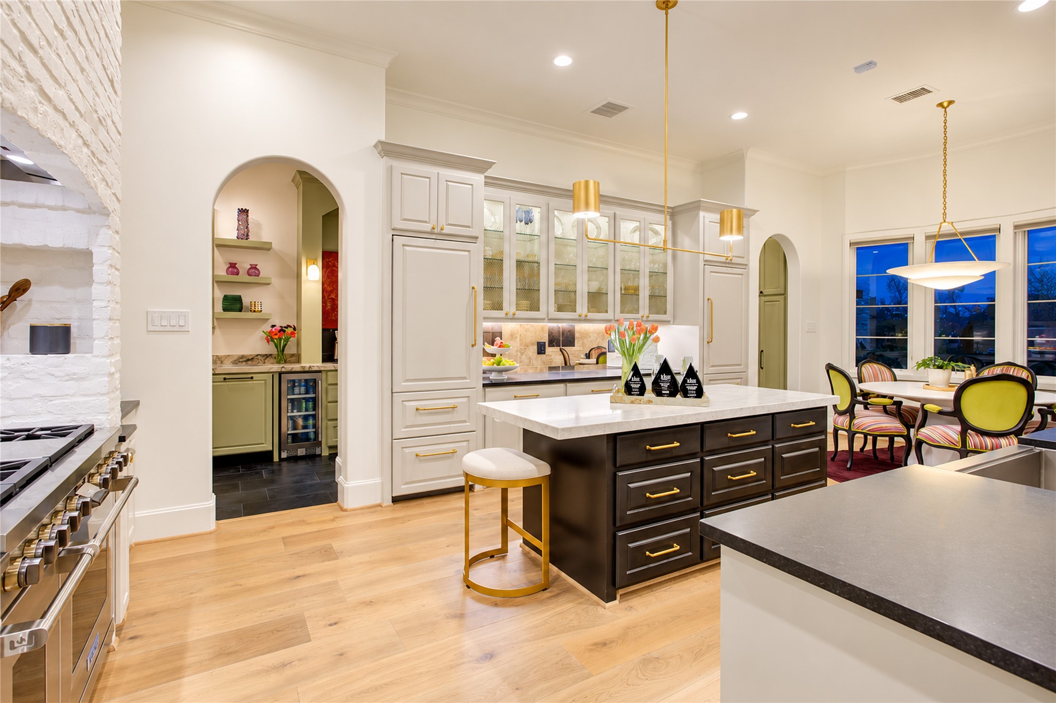 A tailored serving station bridges the all-refrigerator and all-freezer columns, adding thoughtful utility to this chef-inspired kitchen.