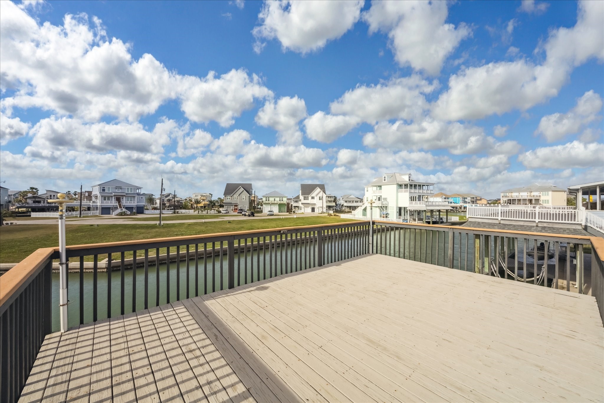 Spacious sun deck overlooking wide water . Ideal for outdoor relaxation and entertainment.