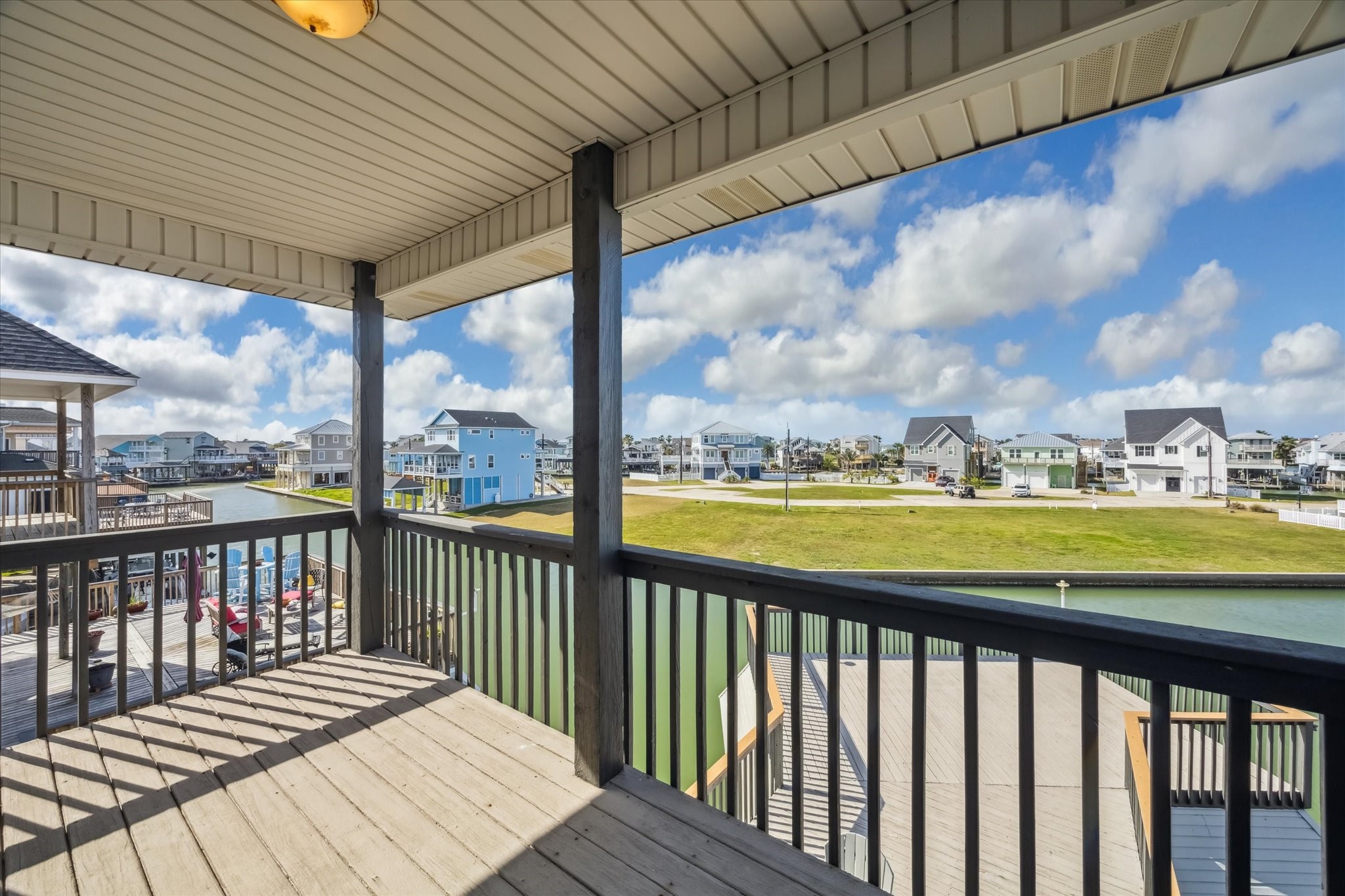 Your  covered porch  offers scenic views of the  waterfront community.