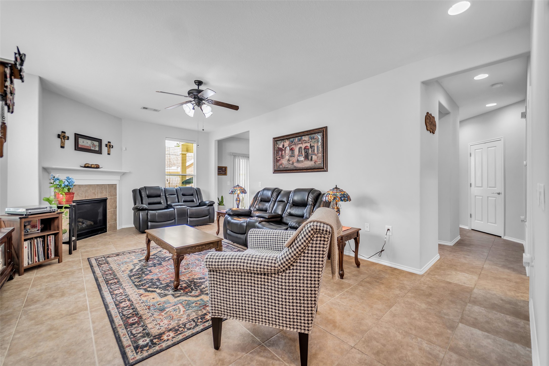 Beautiful tile flooring, fireplace in living room.
