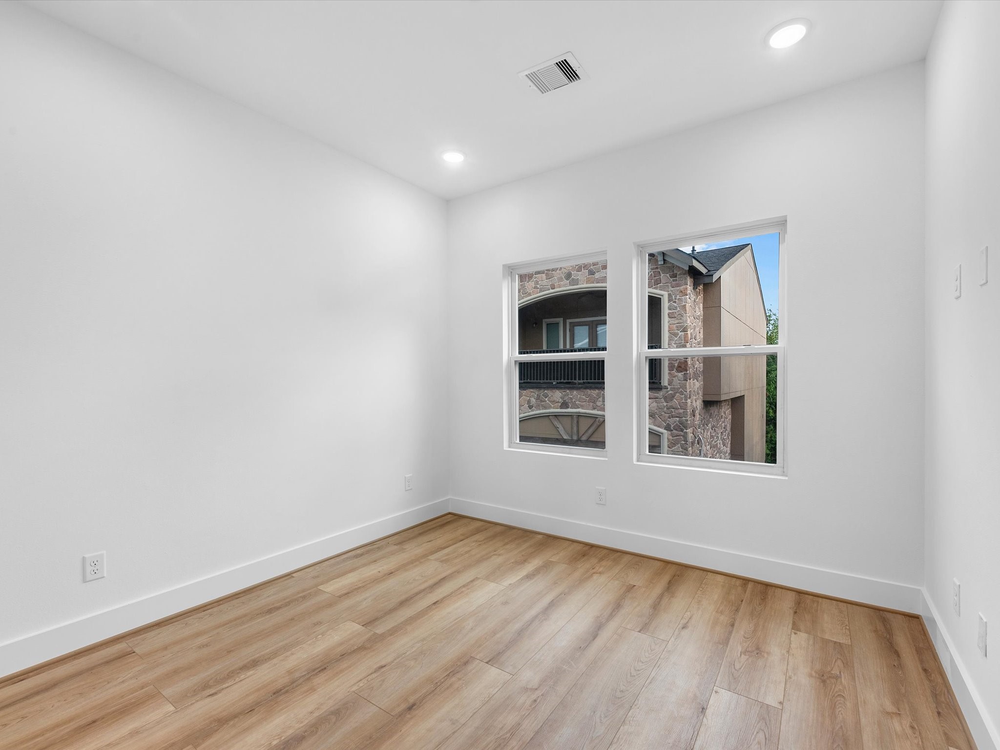 Second third-floor bedroom conveniently located alongside the primary suite, offering a practical and comfortable layout. Having both bedrooms on the same floor makes this floor plan especially convenient for families with younger children.