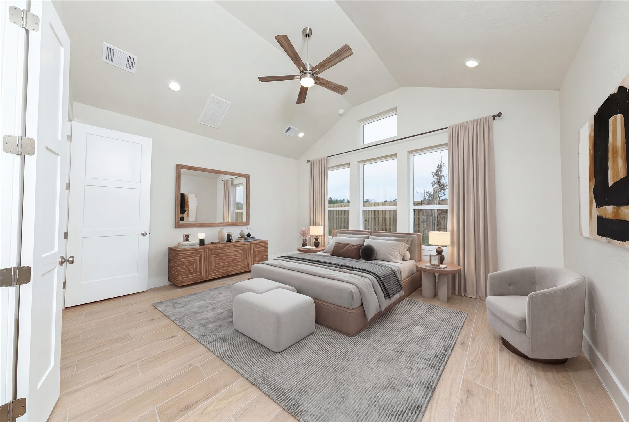 Relax and unwind after a long day in this impressive primary suite! This generously sized room offers tile plank flooring, neutral-toned paint, high ceilings with a ceiling fan, and large windows for added comfort and tranquility. *Virtually Staged
