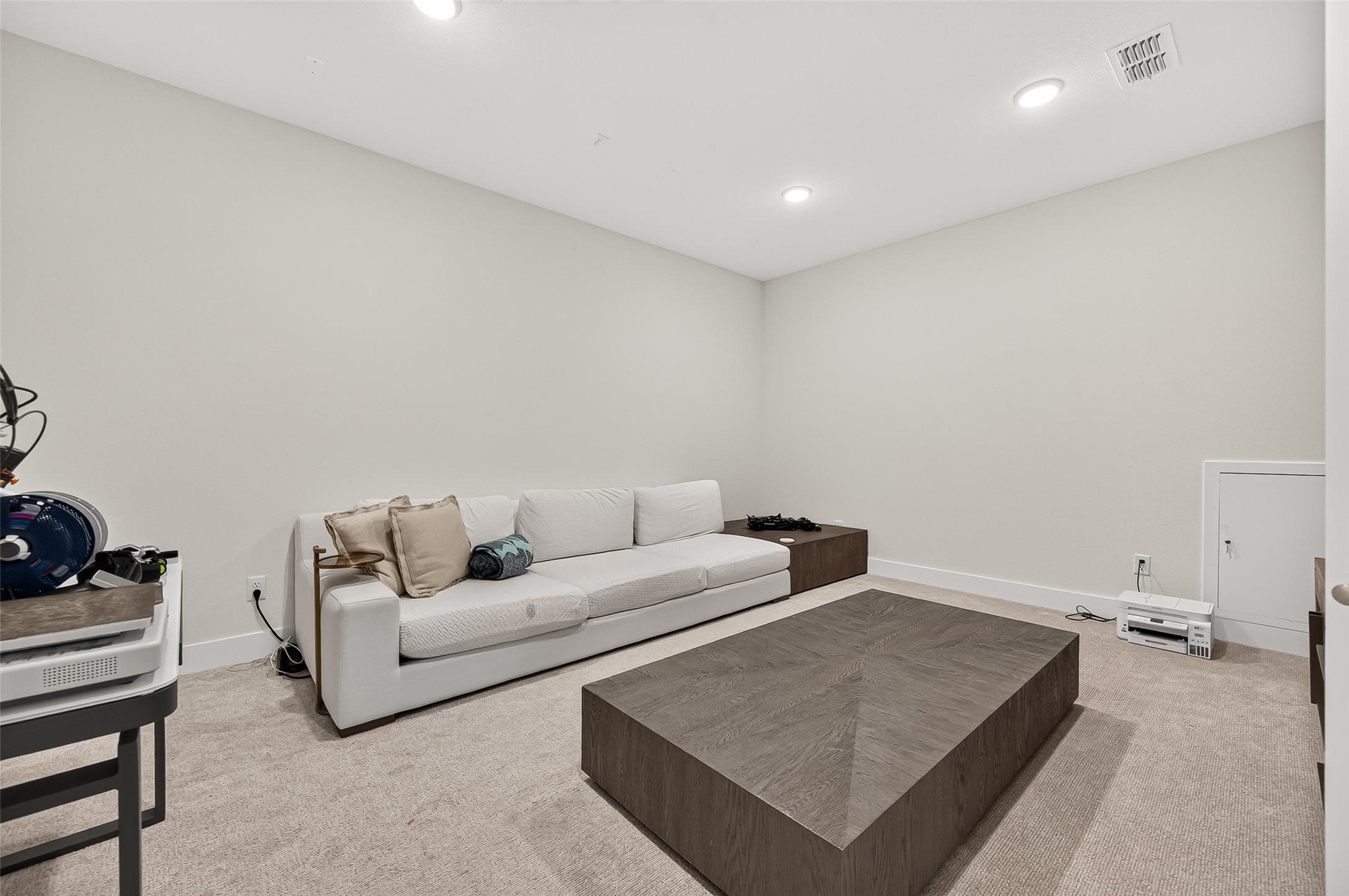 Upstairs, A dedicated media room is wired for sound, creating the perfect space for movie nights and entertainment.