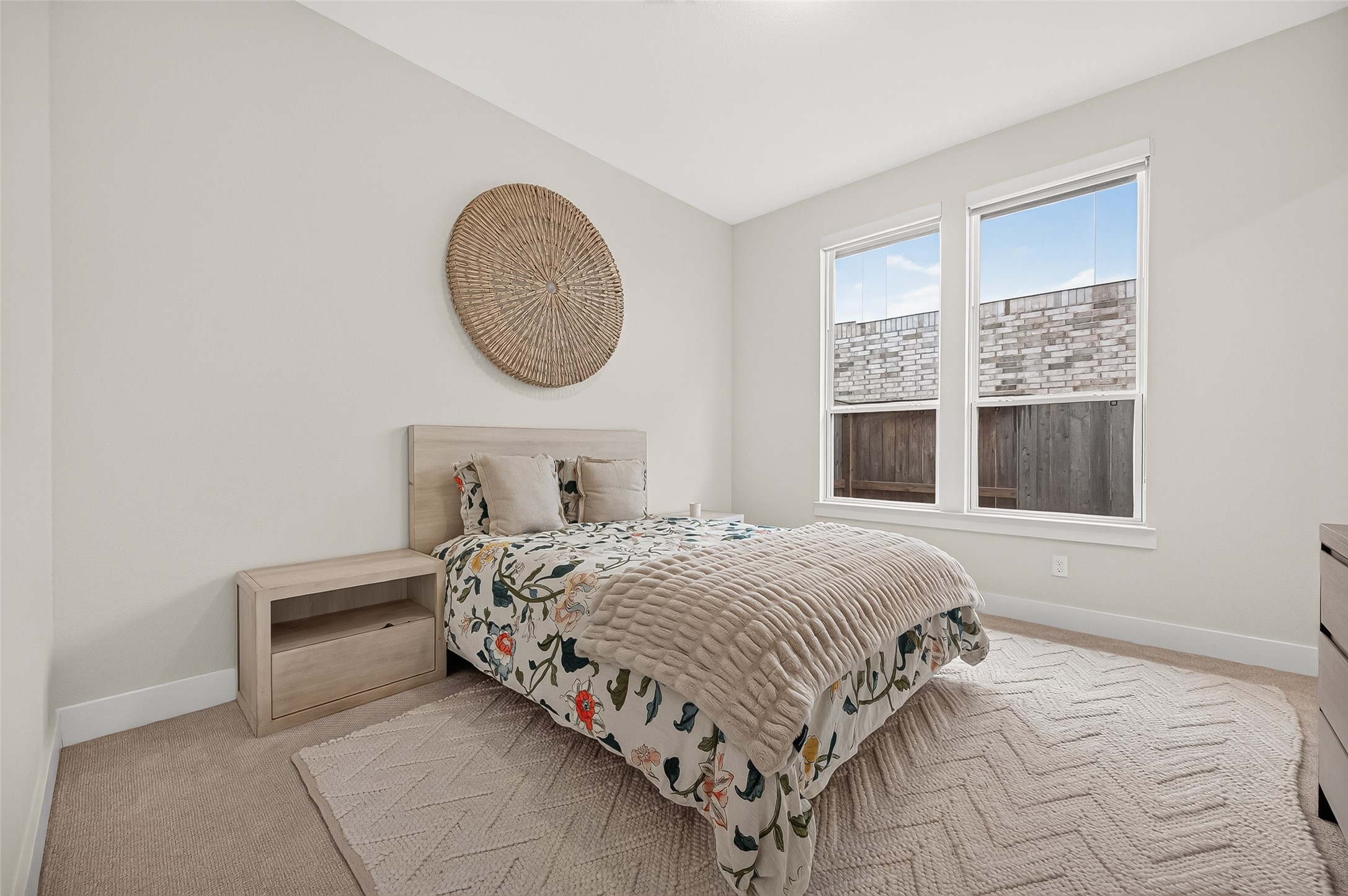 The first floor features two bedrooms, including a spacious secondary bedroom with its own private bath!