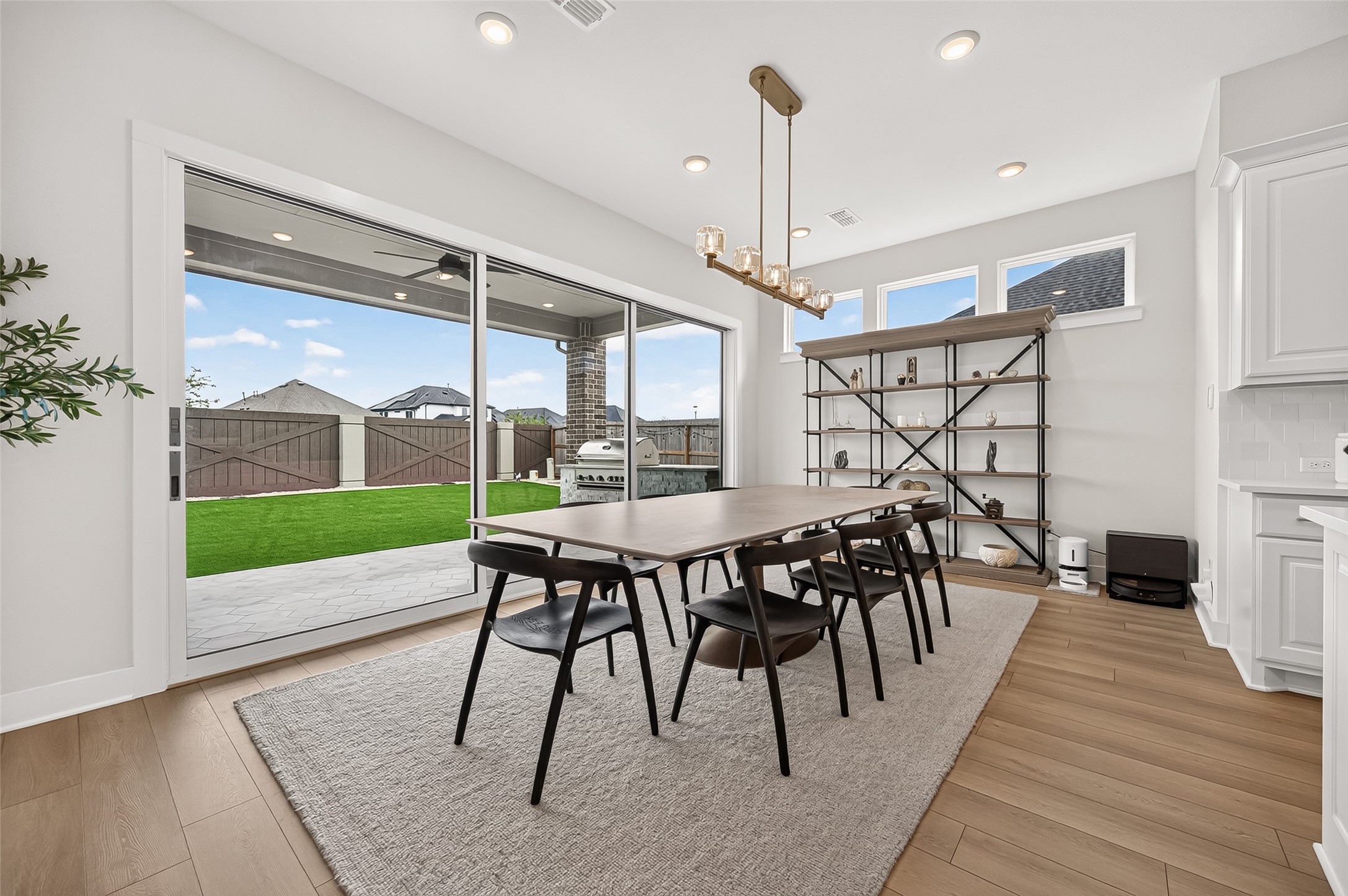 The spacious dining area features sliding doors that open to the backyard patio.