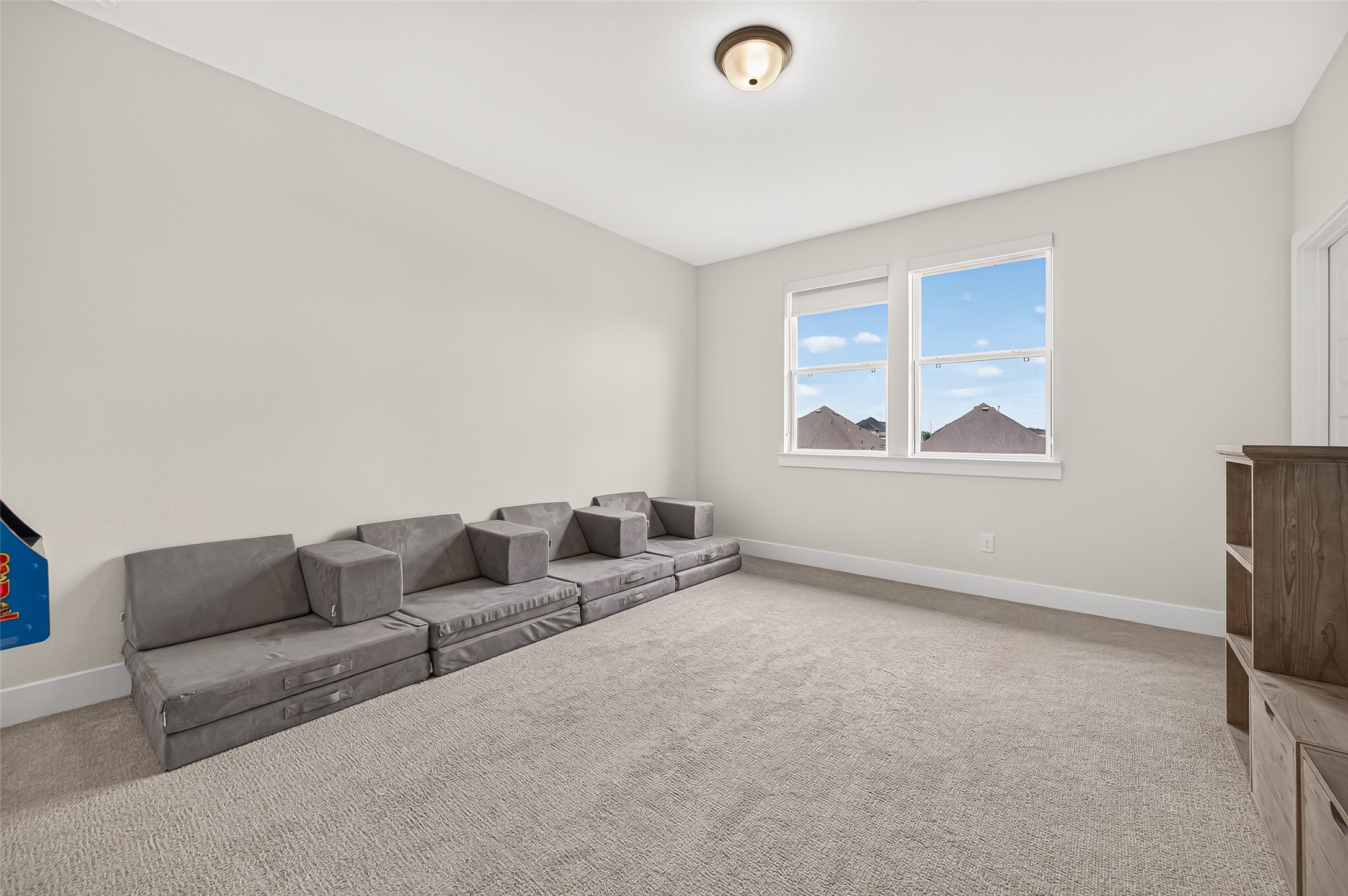 Three additional generously sized bedrooms are located upstairs, all offering spacious walk-in closets. This one shown bedrooms has access to a private bath that also provides convenient access for guests.