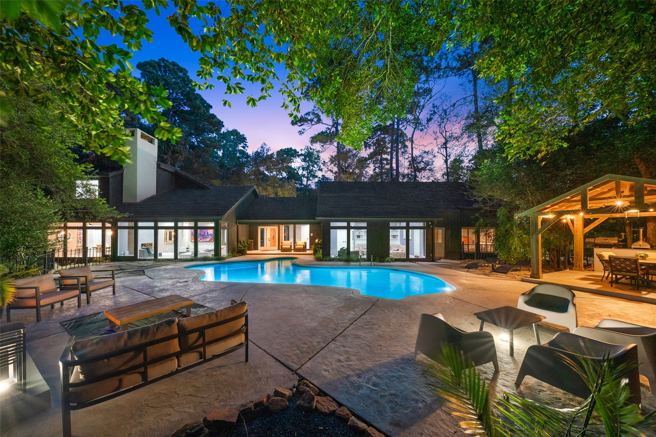 A spacious backyard featuring a sleek swimming pool, surrounded by ample patio space and lush greenery, ideal for outdoor relaxation and entertainment. A spacious backyard featuring a sleek swimming pool, surrounded by ample patio space and lush greenery, ideal for outdoor relaxation and entertainment.