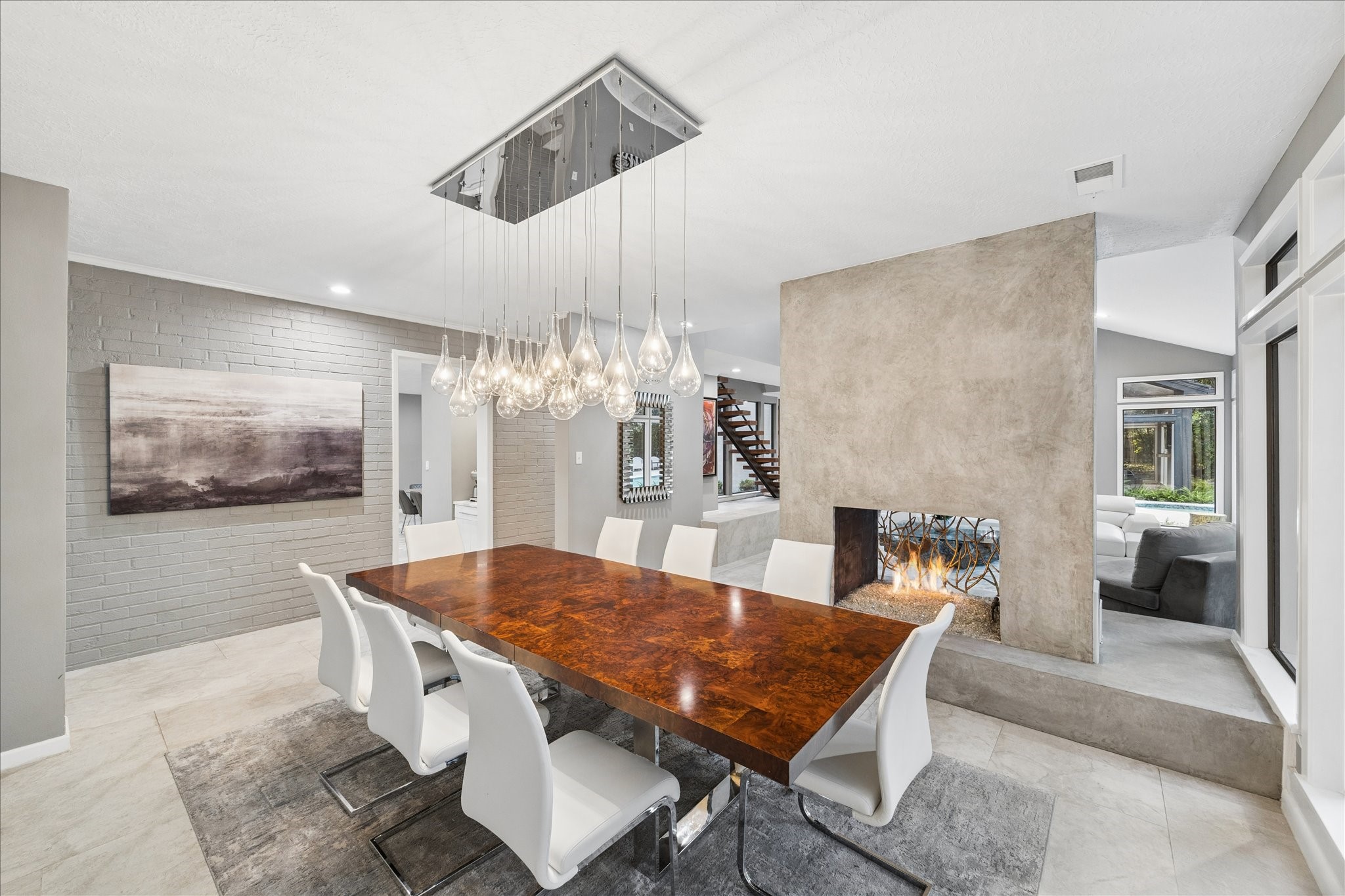 The space is open and bright, with neutral tones and contemporary decor, offering a seamless flow to the living area.