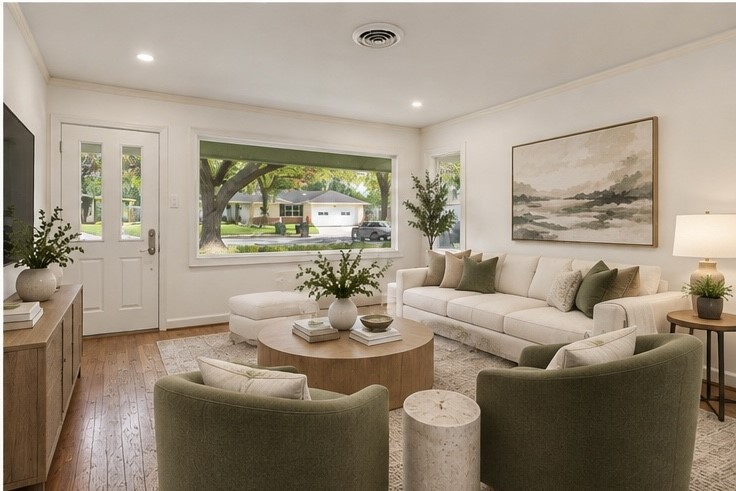 Bright and inviting living room with large windows offering abundant natural light, stylish neutral decor, and comfortable seating ideal for relaxation and entertaining. Virtually staged