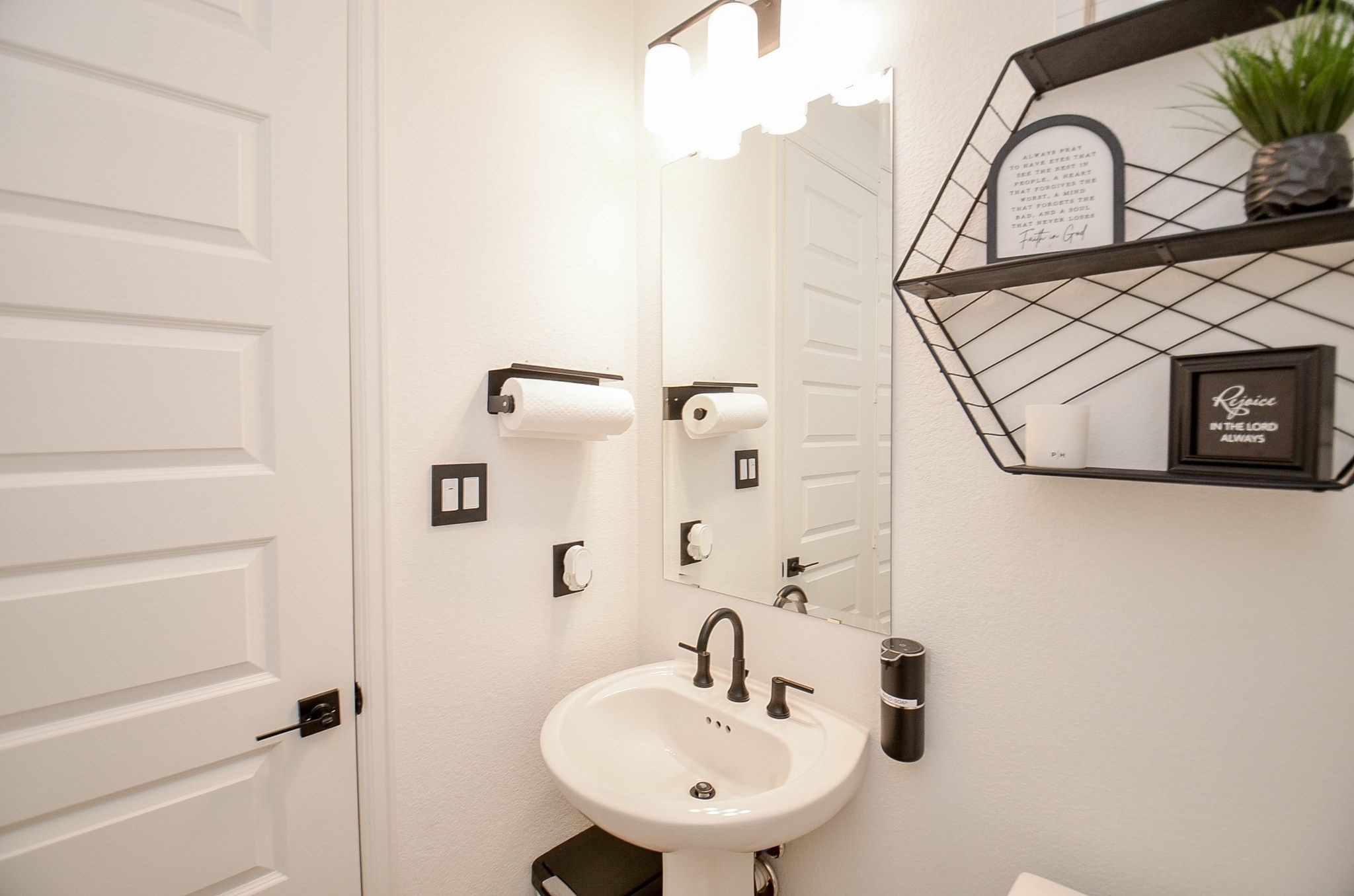 Charming powder room featuring modern fixtures and stylish finishes.