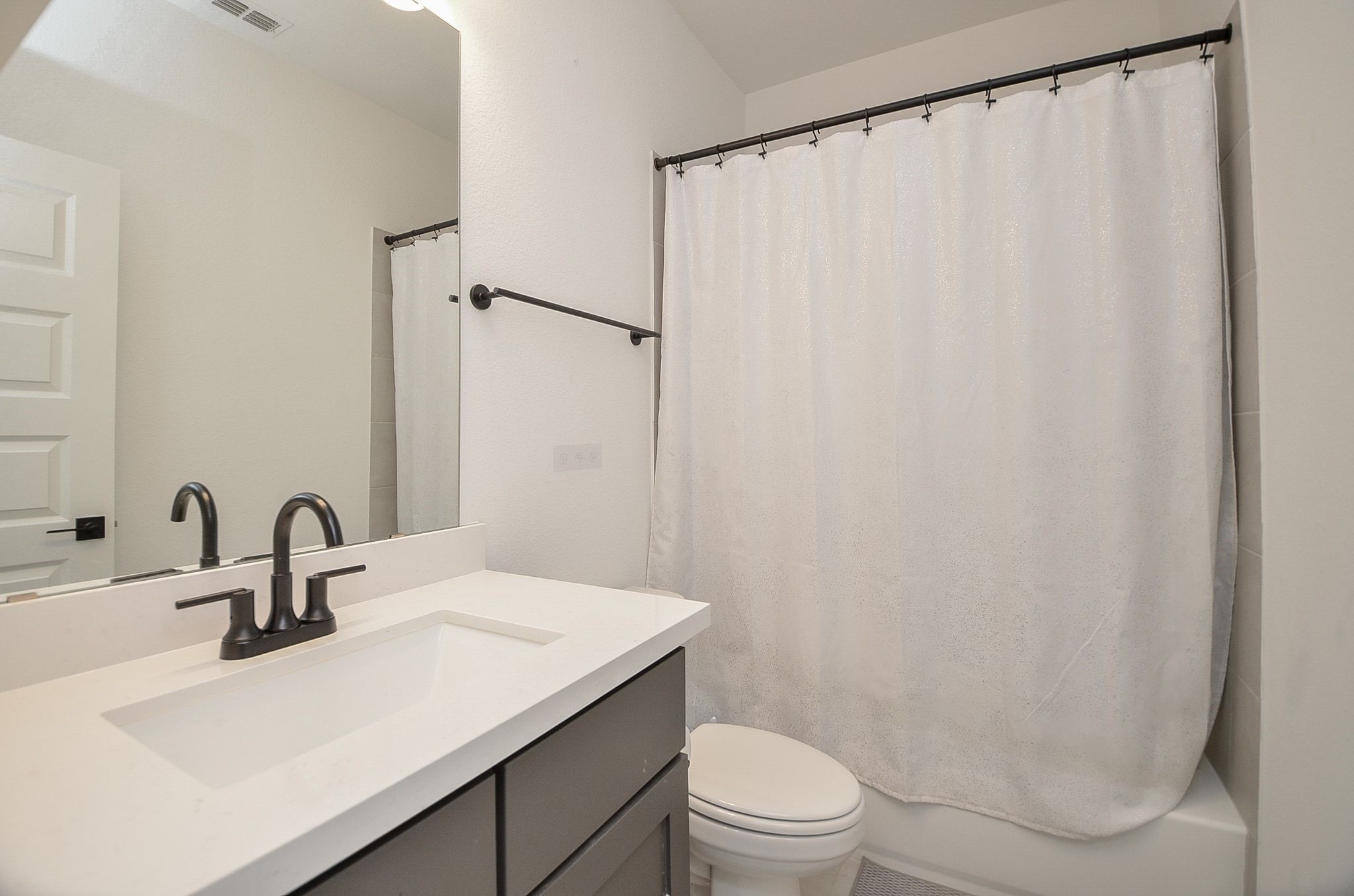 One of the two secondary bathrooms upstairs.