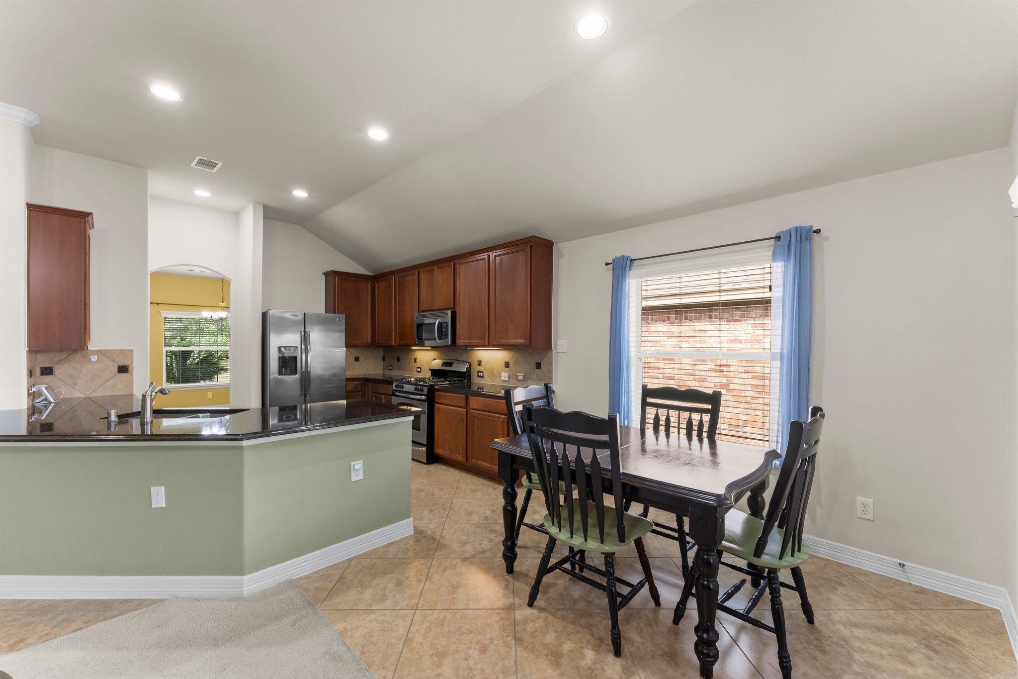 Kitchen opens to the breakfast area.